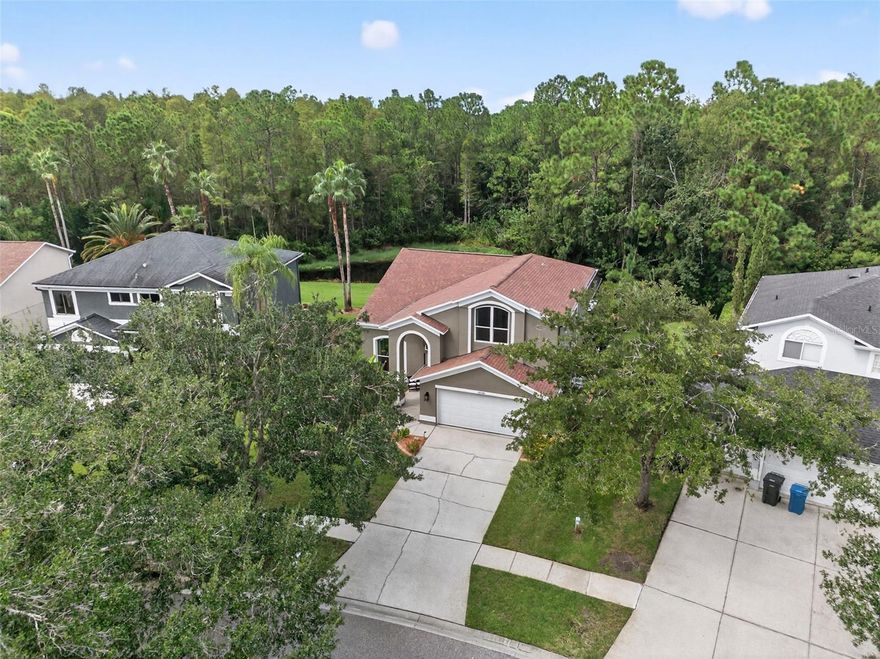 Welcome to this beautifully upgraded 3-bedroom, 2.5-bath home with a versatile loft, nestled in CANTERBURY VILLAGE AT THE EAGLES one of Tampa Bays premier gated golf course communities! This home has been meticulously upgraded with HURRICANE-IMPACT WINDOWS AND DOORS (2023), newer appliances, new ductless A/C & HURRICANE-IMPACT GARAGE DOOR (2022) in the garage, ensuring comfort and energy efficiency year-round, newer AC (2020) as well as many other upgrades. Step outside to your PRIVATE OUTDOOR OASIS (new construction 2022) with a sparkling SALTWATER POOL with heater, chiller, and spa and a large enclosed lanai which is perfect for entertaining; all overlooking the peaceful pond and nature preserve (you will never have rear neighbors). The yard is beautifully landscaped with low-maintenance native plants, combining beauty with ease of care. From the moment you step inside, you’ll be impressed by the expansive ceilings and natural light filling the formal living room. From the living room, dining room, kitchen and family room, you’ll enjoy stunning views of the gorgeous pool and the tranquil nature area with a pond behind the home providing complete privacy with no rear neighbors. The open-concept family room seamlessly connects to the kitchen, creating the perfect gathering space for everyday living and entertaining. Upstairs, the spacious primary suite offers a large walk-in closet and a spa-inspired bathroom with dual vanities, a walk-in shower, and a relaxing garden tub. Two additional bedrooms are generously sized, while the loft provides a flexible space that can easily be converted into a fourth bedroom. As a resident of The Eagles, you can enjoy two 18-hole championship golf courses, nature-filled conservation areas, tennis courts, and a 24/7 guard-gated entrance all just minutes from shopping, dining, top-rated schools.
