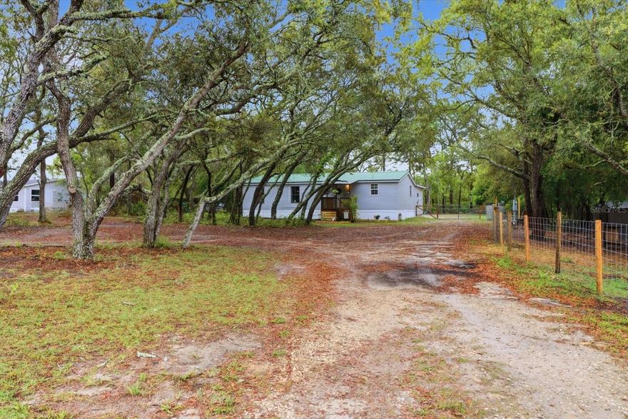 Charming Updated Manufactured Home on 1.04 Acres in Homosassa, FL
Welcome to your own private retreat in beautiful Homosassa! Situated on 1.04 acres of peaceful land, this beautifully updated 1991 manufactured home offers the perfect blend of comfort, functionality, and outdoor living.
Featuring 2 spacious bedrooms and 2 full bathrooms, this home is designed with an inviting open-concept floor plan that feels light, bright, and move-in ready. The kitchen is the heart of the home, complete with gorgeous granite countertops, a large center island perfect for meal prep and entertaining, and ample cabinet space.
Recent updates give this home a fresh, modern feel, including all-new light fixtures and updated ceiling fans throughout. For added peace of mind, the A/C unit was replaced in October 2025, providing energy-efficient comfort for years to come.
Step outside and discover what truly makes this property special. The backyard is fully fenced and now includes both a 16-foot gate and a 4-foot gate, making it easy to bring in boats, trailers, ATVs, or other toys. There is also a dedicated goat pasture, making this property ideal for hobby farming, pets, or anyone looking for extra outdoor space.
Just off the covered back porch, you’ll find a bonus room with electric hookup, perfect for use as a workshop, hobby room, or extra storage space. Please note: the window A/C unit currently in the bonus room will not convey with the sale.
Enjoy peaceful mornings on the massive covered back patio, host gatherings outdoors, or relax by the fire pit under the Florida stars.
Conveniently located just a short drive from local shopping, dining, and the natural beauty of Homosassa Springs Wildlife State Park, this property offers the best of quiet country living with easy access to modern conveniences.
Bring your toys, your animals, and your vision—this Homosassa gem is ready to welcome you home.
Schedule your private showing today!