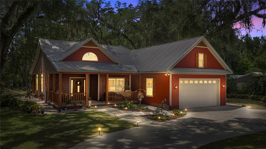 NO HOA! NOT A FLOOD ZONE! METAL ROOF! 2024 HVAC SYSTEM! This well-maintained charming home w/red barn siding is move-in ready and full of upgrades. Nestled among beautiful hardwoods and oak trees, the property is bordered by city-maintained land, providing no rear neighbors and additional privacy and open space. Inside, the home offers abundant natural light, cathedral ceilings, laminate wood flooring, and a cozy natural gas fireplace. The kitchen features granite countertops, custom wood cabinetry and newer appliances including a refrigerator, dishwasher and microwave. The split-bedroom floor plan offers privacy, while the spacious primary suite includes a bay window, glamour bath, double vanities, and ample storage. Additional interior highlights include an inside laundry room, tankless natural gas water heater, water softener and filtration system, and an in-home surround sound system extending to both patios. Recent improvements and features include a new HVAC system (inside and outside units approximately 2 years old), all new LED lighting throughout, annual HVAC and water heater maintenance, underground sprinklers, and Arlo wireless security cameras. Outdoor amenities include a 16-foot paver fire pit area, storage shed, dedicated trailer parking space, and an added rubber driveway barrier designed to help keep debris and leaves out. Dont miss this gem of a home, make your appointment today!