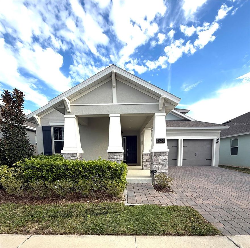 Here is a great opportunity to live in the desirable area of Hamlin with A rated schools and close to groceries stores, movie theater and Orlando Health Hospital. This amazing two-story house full of upgrades built in 2022 has 4 bedrooms and 2.5 bathrooms in the first floor and a huge loft on the second floor with walk-in closet and a full bathroom, 2 car garages with separate gates, a parkway for up to 4 cars and a charming covered porch. The 2 front bedrooms share a full bathroom across an exterior hallway. The living room and dining room come together in a large integrated environment with a beautiful vinyl flooring that includes the kitchen with a large quartz island, eye-cathcing clear beige cabinets with upgraded height, a walk-in pantry and stainless-steel appliances, including a side-by-side refrigerator and a gourmet kitchen with an oven-microwave combo, a large cooktop, a dishwasher and a wall mount range hood. The middle bedroom can also be used as a great home-office, being located right aside the half Bathroom. The master suite has a full bathroom with 2 sinks and a huge mirror. In the spacious master bedroom you will find 2 separate walk in closets and 3 huge windows that give an incredible view of the pool and the back of the house. The huge exterior area in the backyard includes a covered patio and an amazing clear tourquise salt water heated pool.