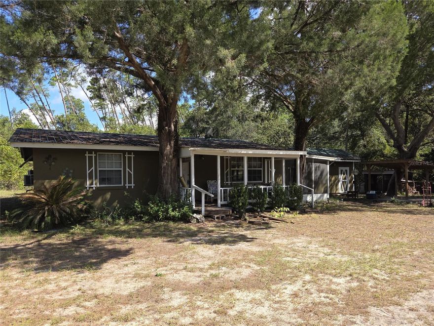 This is a wonderful place to call home, just off Lake Chastain and Little Lake Kerr in a close-knit community. A roomy and charming little 3-bedroom, 2-bath residence with 925 SF of living space and 1314 Sf under roof on just under a third of an acre lot. Come and enjoy the peaceful setting just a minute from E Highway 316. The home has a newer Metal Roof, and multiple storage sheds. There is also a public boat ramp available for your fishing and boating pleasure. City life is always there when you want it, with Orlando, Tampa, and both coastlines within easy driving distance. The spacious yard gives endless possibilities; you can enjoy the great outdoors, time on the nearby lake or soaking up the sun.
