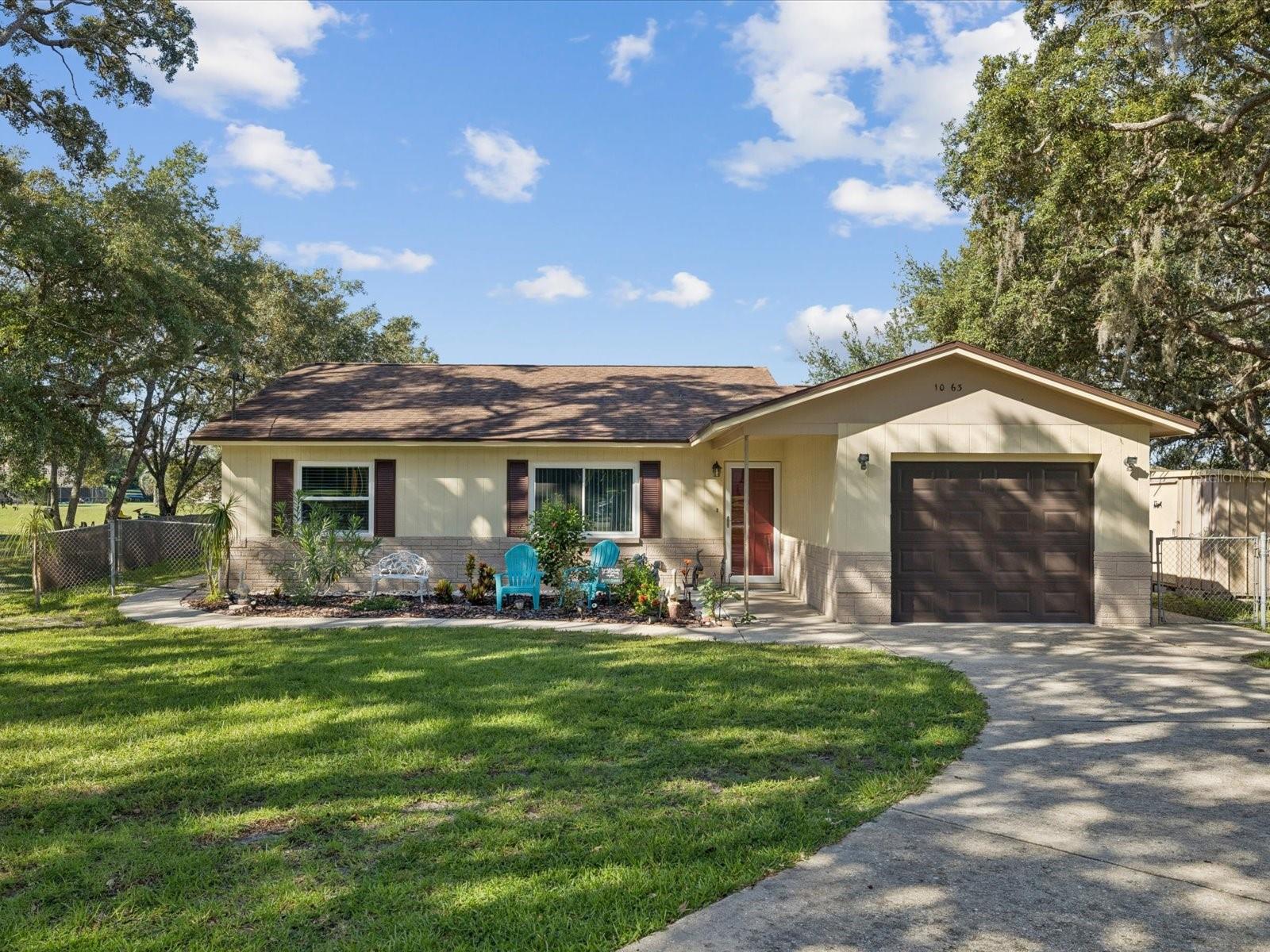 Looking for a lake view without breaking the bank? This charming 3-bedroom, 2-bath, 1-car garage home (county records show 2 bedrooms) is perfect for first-time homebuyers or those looking to downsize. Recently updated with a brand-new heated pool (2021), the property sits on a fenced ½-acre lot backing to Oak Lake, which, while having very little water, provides added privacy and a serene natural backdrop.
Enjoy peace of mind with recent upgrades including new windows (2023), AC (2018), bedroom carpet (2023), and tile flooring in the living areas (2022). The adjacent lot to the left (Key #00250962) is also available for purchase, creating the opportunity to own over 1 acre of land.
Inside, you’ll find a spacious layout with a living room, dining room, family room, and enclosed lanai, ideal for relaxing or entertaining. Located just off Spring Hill Drive and County Line Road, you’ll enjoy easy access to shopping, dining, the Suncoast Parkway, Tampa, and the airport. The circular driveway is surrounded by mature trees, offering shade and a welcoming curb appeal. This move-in ready home is a rare find, schedule your showing today!