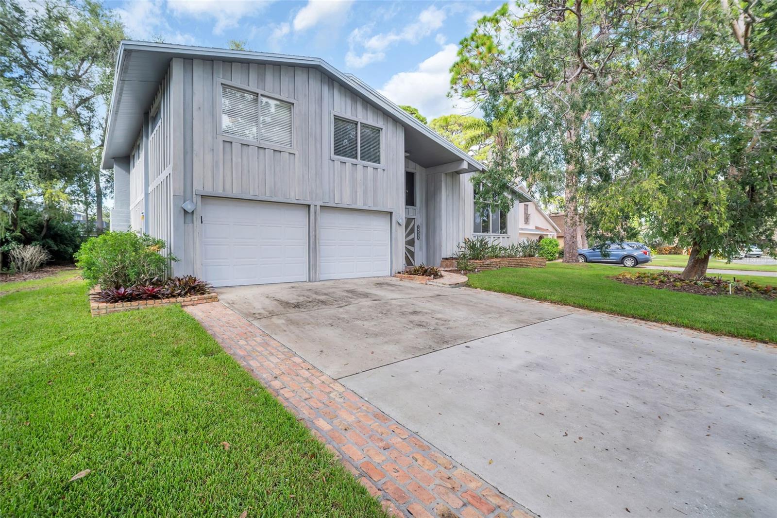 Owned and loved by a single family for over 50 years, this mid-century styled Seminole masterpiece is on the market for the first time since it was built. Three bedrooms, 3 full bathrooms, a primary closet to-die-for, this 2,780 square foot home is filled with elegance and personality.
You enter the split-level home into a giant foyer then up to a living and dining room with soaring ceiling and massive windows overlooking magnificent mature trees and landscaping. The nicely appointed kitchen has Frigidaire Gallery Stainless appliances, a breakfast bar and tile countertops. The lower level has a huge family room complete with a stone fireplace, perfect for game days, movie nights and family entertainment in between. Step outside onto the pavered lanai with a huge in ground pool, protected by a two-story screened enclosure.
Upstairs are three generous sized bedrooms, including a primary suite and second bathroom for easy family living. Need extra room for your regalia? The shoe-store sized primary closet awaits you and your inventory.
Located on a cul-de-sac among mature landscaping, the home is in the highly desirable Whispering Pines Forest section of Seminole and is close to schools, shopping and beaches.
ROOF 2018 / HVAC (2 units) 2023 / WATER HEATER 2018