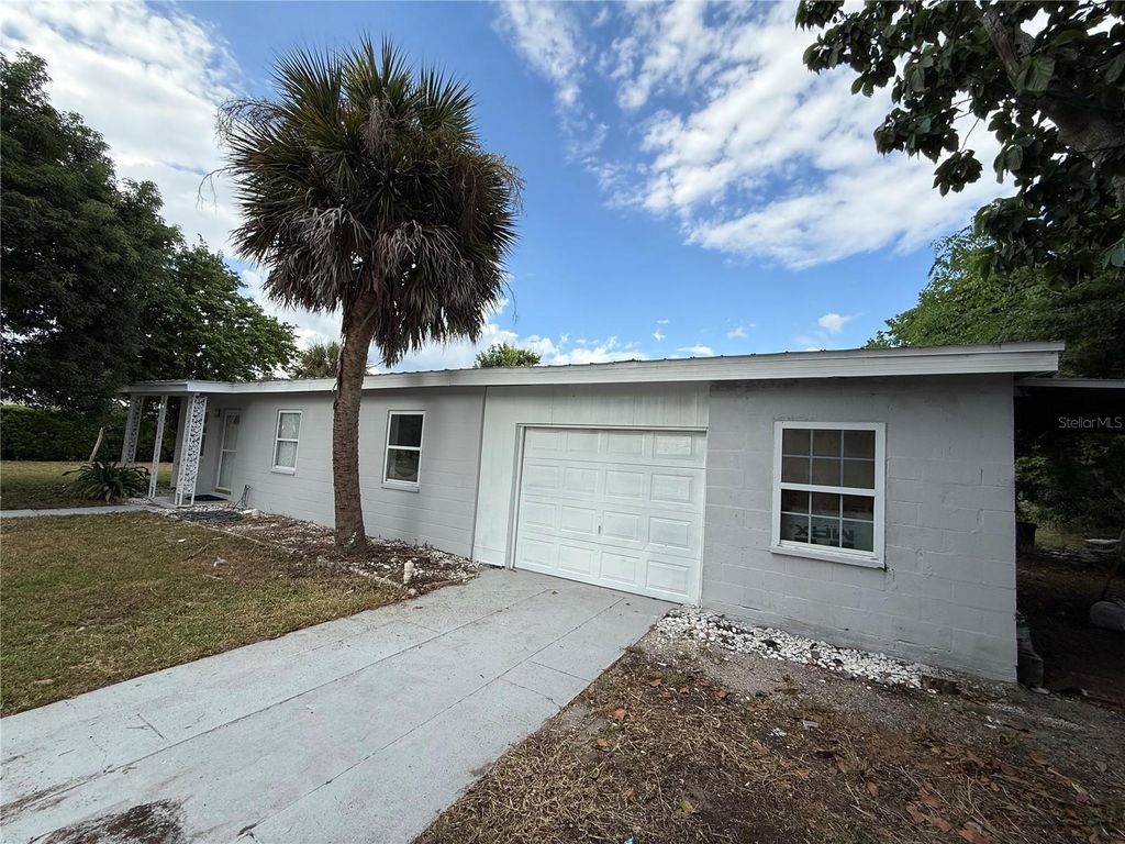 Photo of 203 Waterway Circle NE, Port Charlotte, FL 33952 (MLS # C7515677)