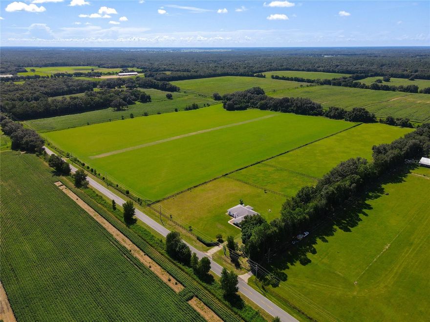 This is probably the most GORGEOUS piece of land in the area! Nice and flat, BEAUTIFUL trees towards the back, LUSH Bahia grass throughout and RICH Soil that is state tested! This property is currently INCOME PRODUCING and used for Hay Rolls and Sod!! Very HIGH QUALITY land and already perimeter fenced too. Seller may consider OWNER FINANCE with the right terms. PERFECT and CONVENIENT location just 5 minutes to Rainbow Springs, 15 min. to WORLD EQUESTRIAN CENTER, 20 min to Ocala, 35 min to Gainesville, 30 min to the Gulf and Crystal River!
POTENTIAL FOR 25 ACRES TOTAL, 10 ACRES ADJACENT WITH A HOME IS ALSO FOR SALE