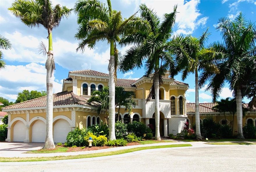 Welcome to a beautiful custom residence in Portofino on the Bay, a boutique waterfront community nestled along Little Sarasota Bay. Privately positioned on a quiet cul-de-sac and just a short walk from the water and its private deeded boat slip, this stunning Mediterranean-inspired home offers an elevated lifestyle defined by elegance, comfort, and exceptional design. A dramatic yet inviting entry introduces soaring 23-foot ceilings, abundant natural light, and expansive living spaces thoughtfully designed for entertaining and effortless everyday living. The grand living room, anchored by a fireplace and walls of glass sliders, seamlessly opens to the screened saltwater pool and spa, creating a true indoor-outdoor retreat. The state-of-the-art chef’s kitchen is both beautiful and functional, featuring granite countertops, custom cabinetry, an oversized island, premium appliances, a Viking range, and a warming drawer designed to impress culinary enthusiasts and guests alike. The luxurious first-floor primary suite is a private sanctuary, offering spacious custom his-and-her closets and a spa-inspired ensuite bath complete with dual vanities, a large soaking tub, and a steam shower featuring three shower heads. Also conveniently located on the first floor are a spacious den/office with two built-in desks and a Murphy bed, as well as one of the guest bedrooms. Upstairs, a dramatic balcony overlooks the main living spaces below, while three additional guest bedrooms offer beautifully appointed accommodations with custom built-in closets. One bedroom features an ensuite bath, while the other two share an elegant Jack-and-Jill bathroom. Designed with comfort and wellness in mind, the home also features a whole-house water filtration system and reverse osmosis water systems with remineralization in both the kitchen and upstairs living area. With no flood insurance required, enjoy the benefits of living near waterfront, including peaceful walks to watch spectacular sunsets, fishing from the dock, and effortless boating from your private deeded boat slip with a 10,000-pound lift and direct access to the Intracoastal Waterway and Gulf waters beyond. Additional community amenities include kayak launch access, dedicated kayak storage, and a guest boat slip for visiting boaters. Ideally located just minutes from the nationally recognized Pine View School, world-class dining, shopping, downtown Sarasota's cultural attractions, and the white sands of Siesta Key Beach, as well as Nokomis Beach and charming downtown Venice. Opportunities like this in Portofino on the Bay are rare—don't miss your chance to make this stunning home your own!