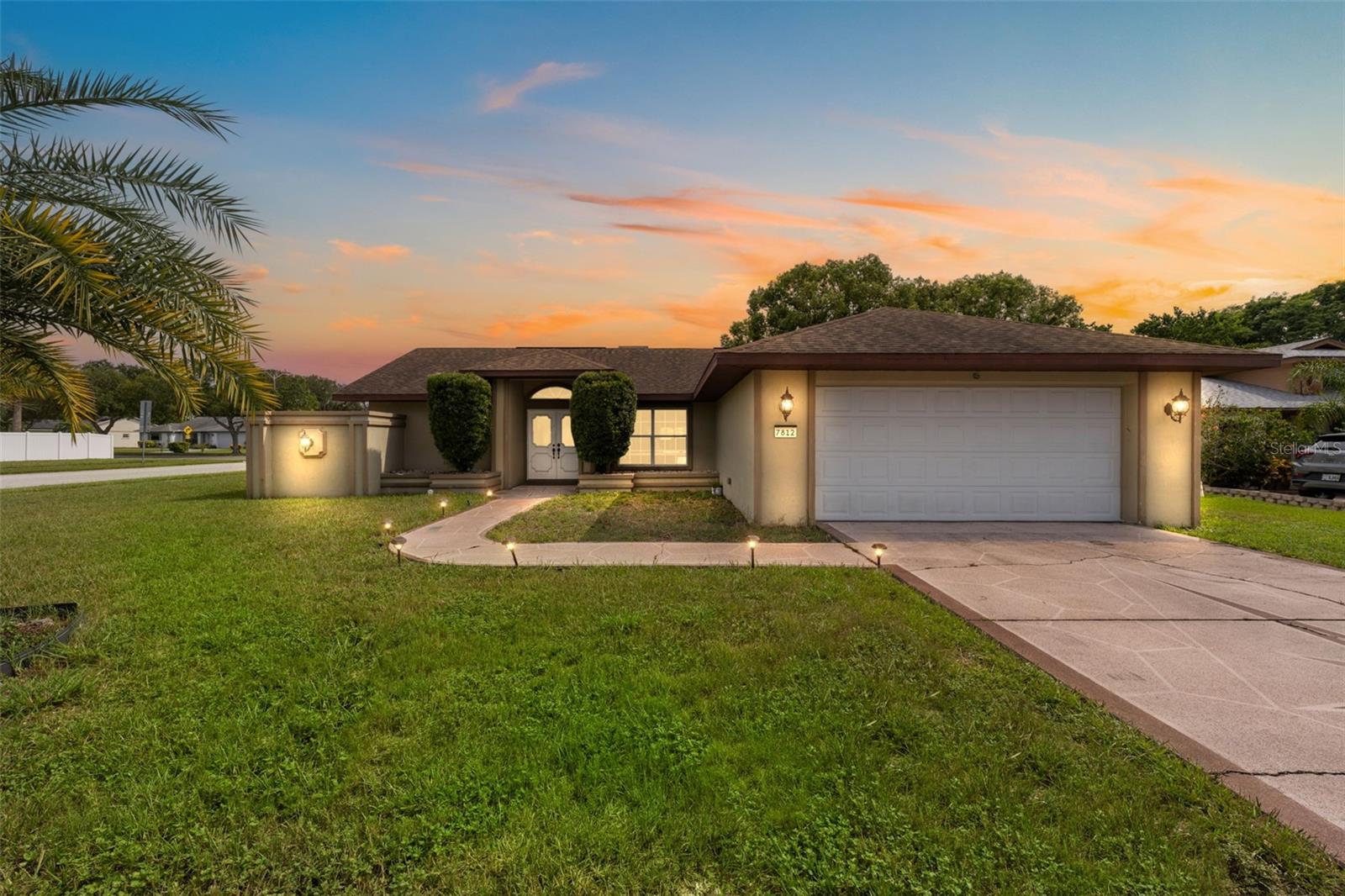 Meticulously kept 3 bed, 2 bath home embodies quintessential Florida living with a pool, ideal for year-round relaxation. Step inside to discover an open floor plan infused with Florida charm, boasting stylish finishes and abundant natural light. Outside, the private backyard oasis beckons with an expansive deck, fully fenced yard, and lush landscaping, creating the perfect backdrop for entertaining guests or unwinding in solitude. Conveniently situated just 40 minutes from Tampa International Airport and under 90 minutes from Disney, this home offers easy access to area beaches, parks, and renowned sportfishing destinations off the Gulf and Nature Coast. Embrace the essence of Florida living in Lakeside Woodlands! Plus, enjoy the benefits of LOW HOA and NO CDD fees, along with NO FLOOD insurance required, making ownership worry-free. Yard fully fenced for added privacy and security, completing this perfect Florida retreat!