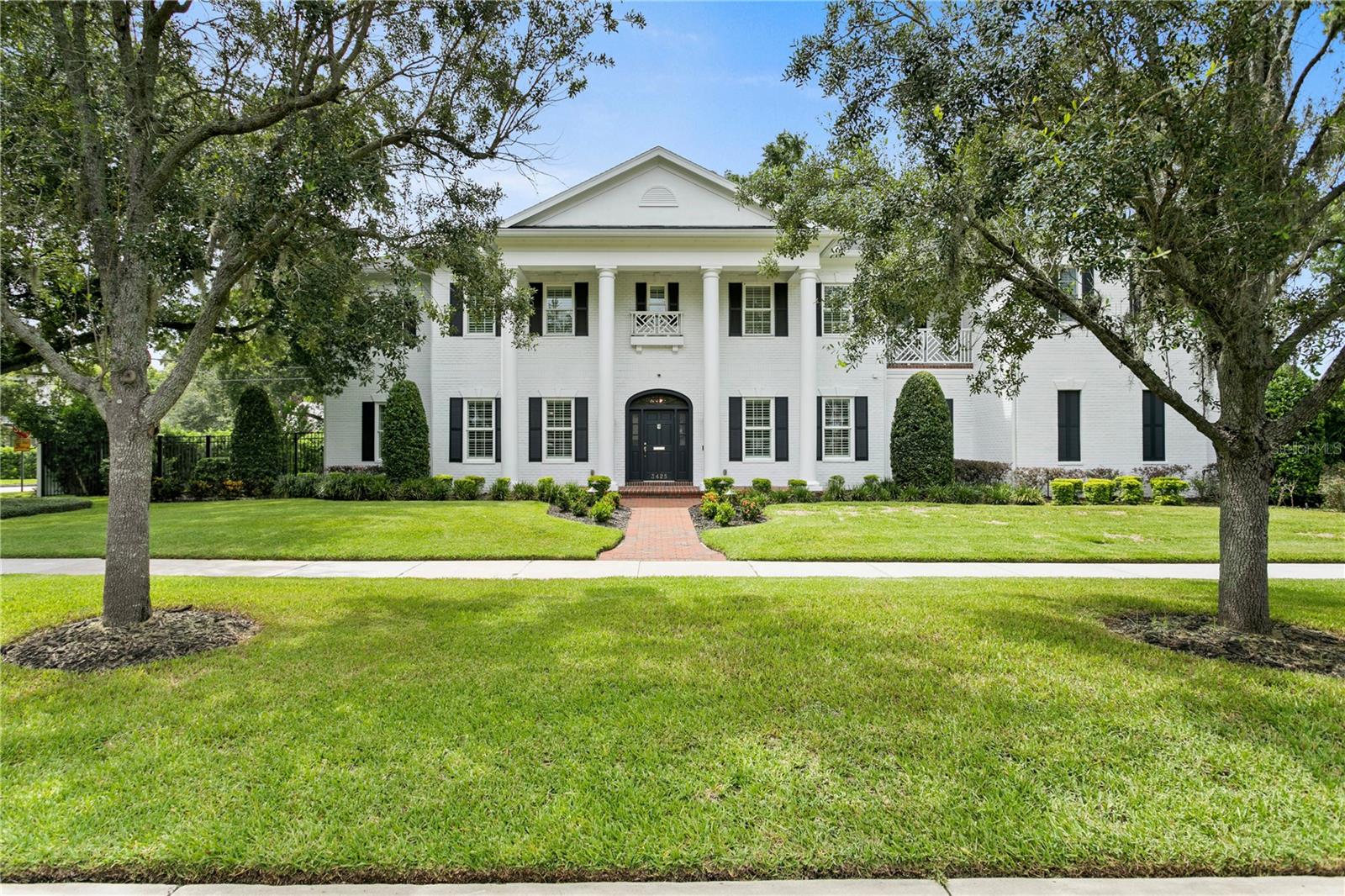 Nestled on one of South Tampa's most serene streets, with charming tree canopied brick roads along the Palma Ceia Golf & Country Club, this immaculate residence offers unmatched luxury & tranquility. The custom-built 4900 sf home boasts 5 spacious bedrooms, a versatile bonus room, & 4.5 bathrooms. Every detail has been thoughtfully designed to provide maximum comfort & sophistication. At the heart of the main floor is a gourmet kitchen boasting an oversized island, chef’s quality La Cornue range, 60" Sub-Zero refrigerator, Bosch dishwasher, oversized cast iron porcelain-finished farm sink, & a full floor to ceiling pantry. The custom maple cabinets are complemented by opaque marble counters & full slab backsplashes. Just around the corner, find a matching built-in dry bar with a wine fridge. In the adjoining living room, enjoy cozy evenings by the gas fireplace or entertain guests with ease in the spacious open floor plan including 10-foot coffered ceilings & French doors leading directly to a screened-in lanai, custom tiled with cement terrazzo flooring & trimmed in wood pillars & a bead board ceiling. There is also a formal dining room & sitting room off the spacious entry, all trimmed in crown molding to match the rest of the first floor. True European Oak wide plank flooring is carried throughout both floors of the home. The first floor also features a spacious guest bedroom with a large closet & full guest bathroom with access to the lanai. The additional downstairs bedroom includes a private lanai & access to a convenient half bath nearby. Upstairs, the oversized primary bedroom offers grand vaulted ceilings & private balcony access. Custom boutique-style built-ins line the large walk-in closet. The en-suite bathroom features two furniture-style vanities with marble countertops, marble slab shower walls, polished/honed Onyx France marble flooring, a large shower with dual shower heads, & a separate garden-style soaking tub. Two additional bedrooms upstairs feature walk-in closets & are linked by a Jack & Jill bathroom, finished with custom cabinetry, leathered marble counters, & robust cement terrazzo flooring. The fourth upstairs bedroom includes built-in benches with storage underneath & a walk-in closet. Its private en-suite bathroom is finished floor-to-ceiling in custom water jet marble mosaic by Onyx France with a large walk-in shower. The outdoor space features a Bahia sodded yard, multi-zone irrigation, professionally designed landscaping, & VOLT solid brass LED landscape lighting. The backyard features Astroturf with cement step stones, a separate fenced area for pets, & 6' privacy fencing. *IMPORTANT NOTE- the property also includes an additional adjoining parcel measuring 15x121’ to be added to the existing back yard which will allow plenty of space for a pool & spa ($100k pool/spa package included in sales price, rendering coming soon)* The oversized 2-car garage includes overhead & side-driven garage door openers with WiFi capabilities, exterior keypads, a 50-amp circuit for an EV charger, a 5000 lb hydraulic car lift making space for a third car inside, fully insulated doors, overhead storage, & a hybrid water heater. Other sweeping improvements made with quality & longevity in mind include a new HVAC system, new roof with a self-sealing membrane under 50-year architectural shingles & whole house-water filtration system. Quality & craftsmanship show throughout this home & it’s absolutely turn key for the next owner.