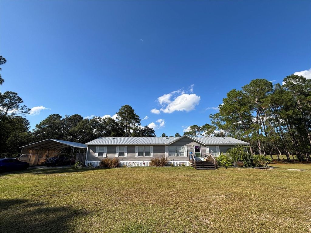Photo of 8260 SE 175th Court, Ocklawaha, FL 32179 (MLS # OM712012)