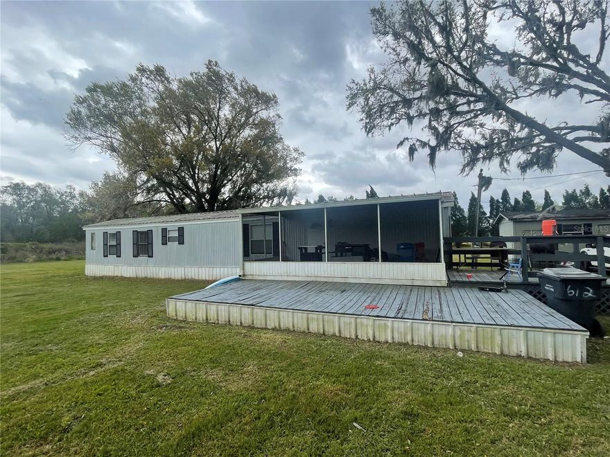 FL living at an affordable price or great investment property!  This 2BD/2BA home is situated on 0.94 acres.  Short distance to all shopping, schools, medical facilities, and restaurants. Make this your new winter retreat or year around home. Call today, don't miss this great investment opportunity.