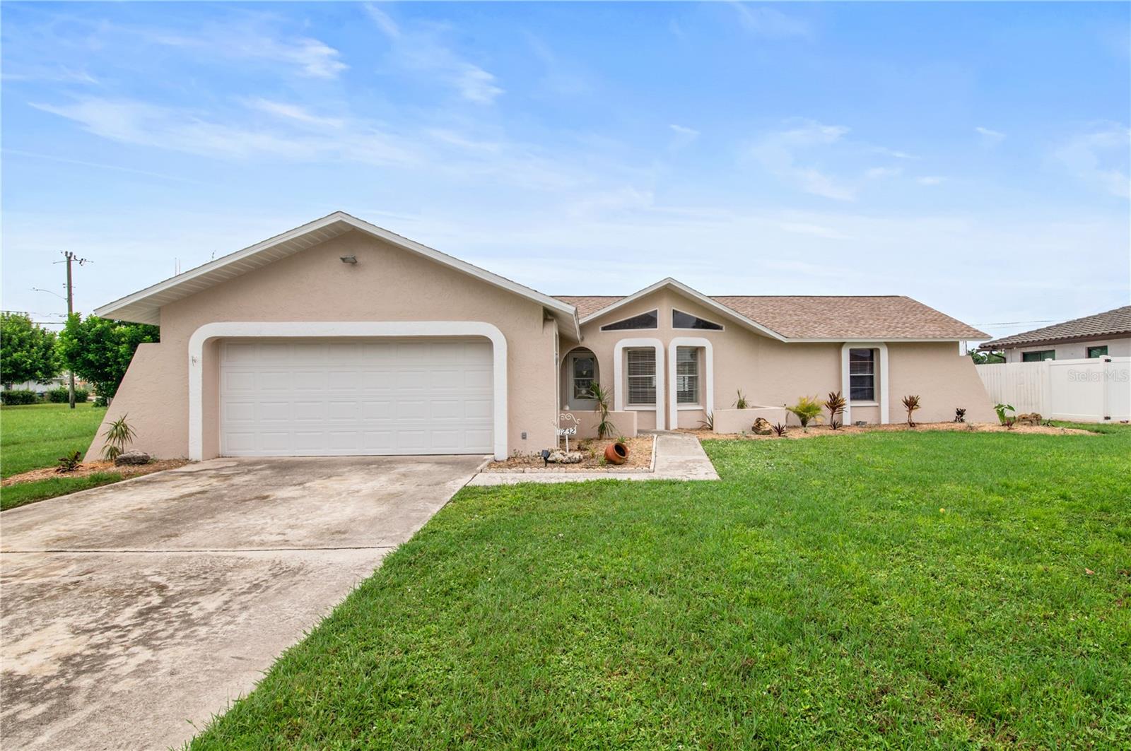 Welcome to Your New Oasis! This charming 3-bedroom, 2-bath pool home offers the perfect blend of comfort, space, and Florida living. Flooded with natural light throughout, the open layout makes every room feel warm and inviting. The roof was replaced in 2023, providing you with peace of mind, and the home has been well-maintained—just waiting for your personal touch and a few updates to truly shine. Step outside to your screened-in lanai, where you can lounge by the sparkling oversized pool or gather at the outdoor bar to watch the game with friends and family. It’s the ultimate setup for entertaining or relaxing in your own private retreat. Location couldn’t be better, you’re just minutes from top-rated schools, popular shopping centers, and Downtown Fort Myers for dining and entertainment, plus plenty of local Cape Coral retail and dining options. Running errands, planning family outings, or enjoying a night on the town has never been easier. Don’t miss the chance to own this well-cared-for pool home in a prime Cape Coral location!