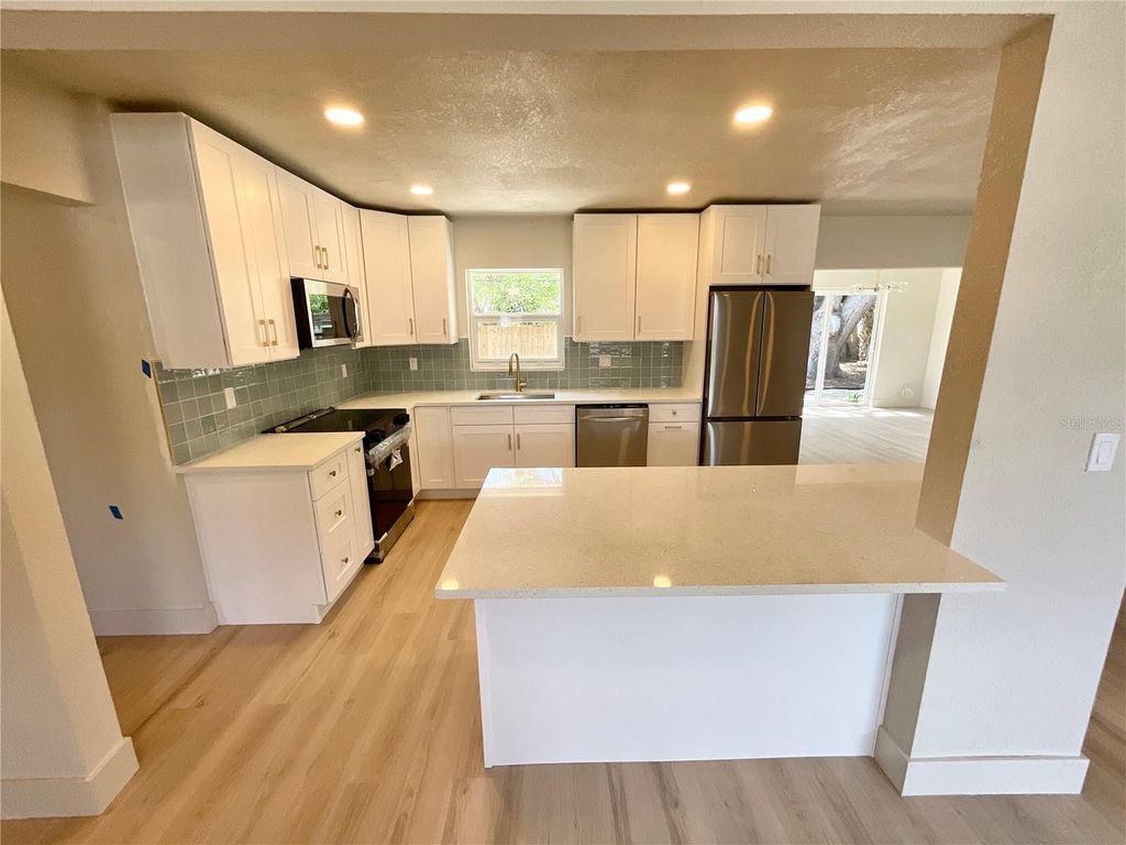 Photo of 644 Manor Drive W, Dunedin, FL 34698 (MLS # TB8494113)