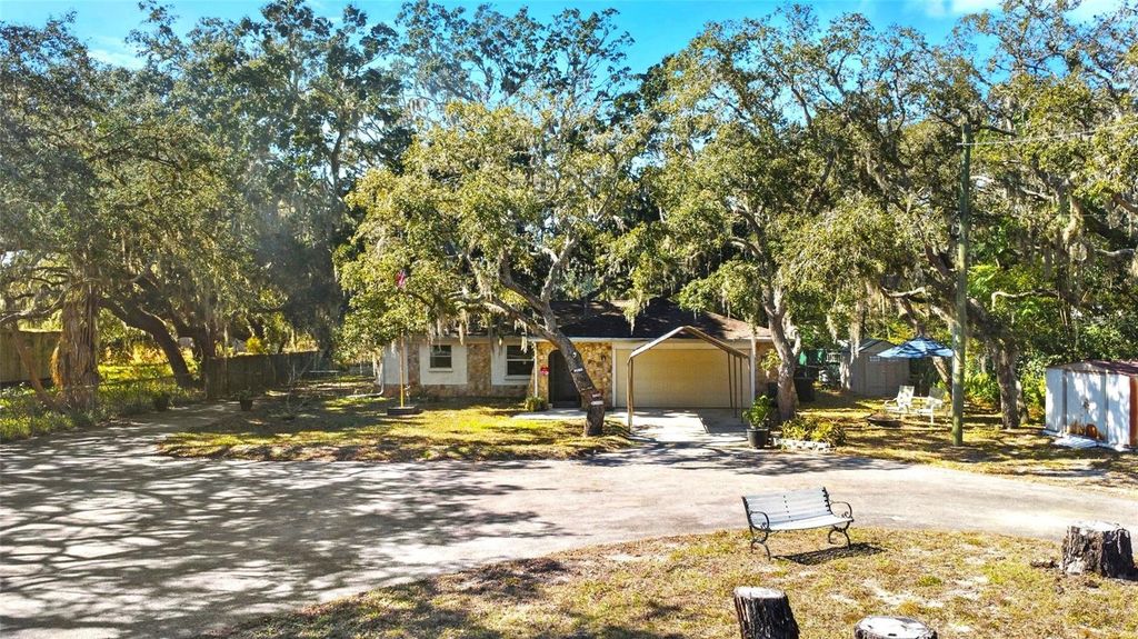Photo of 10100 Frierson Lake Drive, Hudson, FL 34669 (MLS # TB8471003)