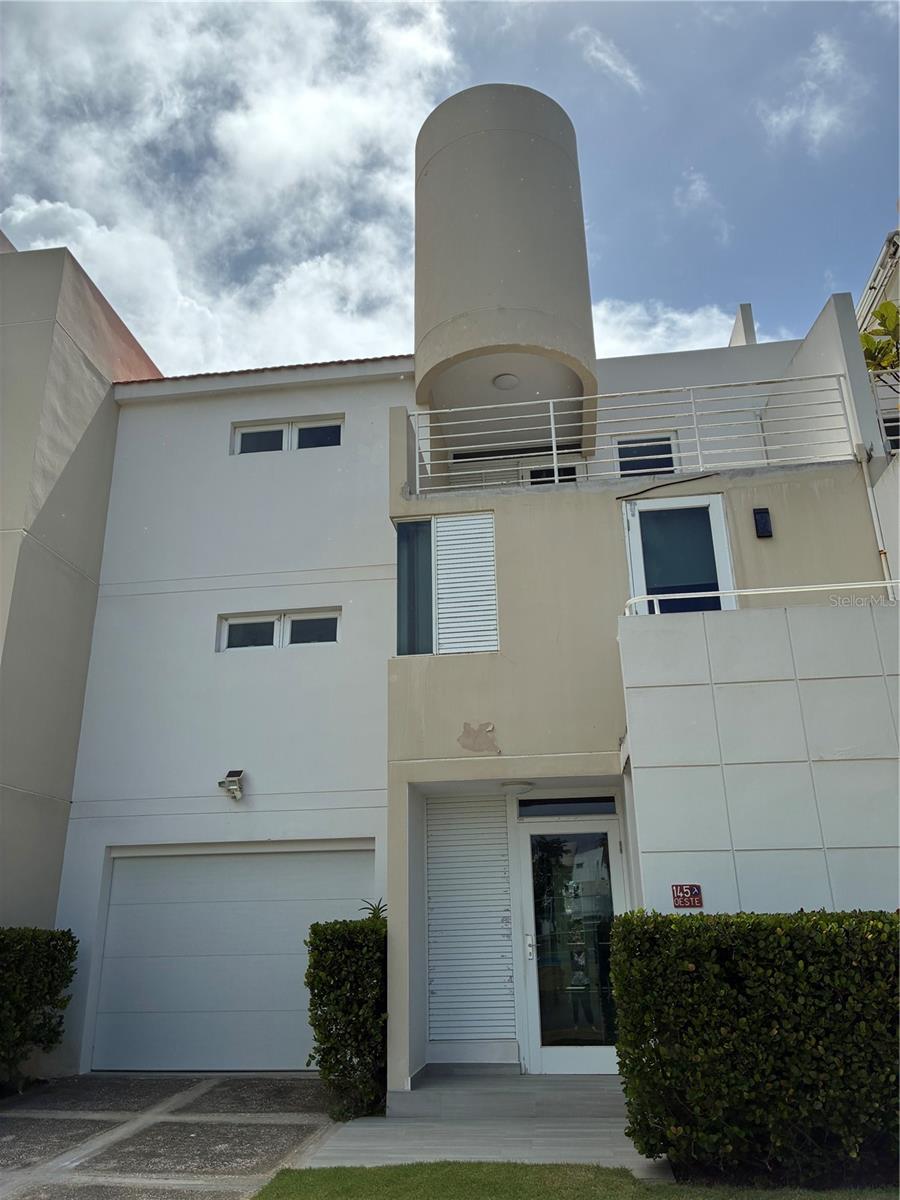 Experience luxury living in this stunning 4-level villa located in the Villas del Golf Oeste community in Dorado, Puerto Rico. This completely renovated residence offers modern elegance, spacious comfort, and top-tier finishes throughout.
Property Features:
4 Levels – Each floor includes balconies or terraces, all with tiled floors (except for the fourth floor).
4 Bedrooms / 4 Bathrooms – Every bedroom features an en-suite bathroom and dual closets, providing privacy and convenience.
Ground Floor Layout – Includes an expansive, fully remodeled and extended kitchen, dining area, living room, family room, and outdoor terrace.
Modern Kitchen – Fully updated with high-end finishes, appliances, and custom cabinetry.
Fully Furnished – The villa will be sold fully furnished with all brand-new furniture, appliances, air conditioners (inverter units), Apple TVs, televisions, and more. The family room is equipped with brand-new cinema-style seating.
Renovated Outdoor Space – Terrace updated with new flooring, sink, and counter space – ideal for outdoor entertaining.
Private Garage – Single-car garage with a brand-new garage door.
This move-in-ready villa offers a rare opportunity to own a turnkey property in one of Dorado's most sought-after communities, ideal for use as a primary residence, vacation home, or investment property.