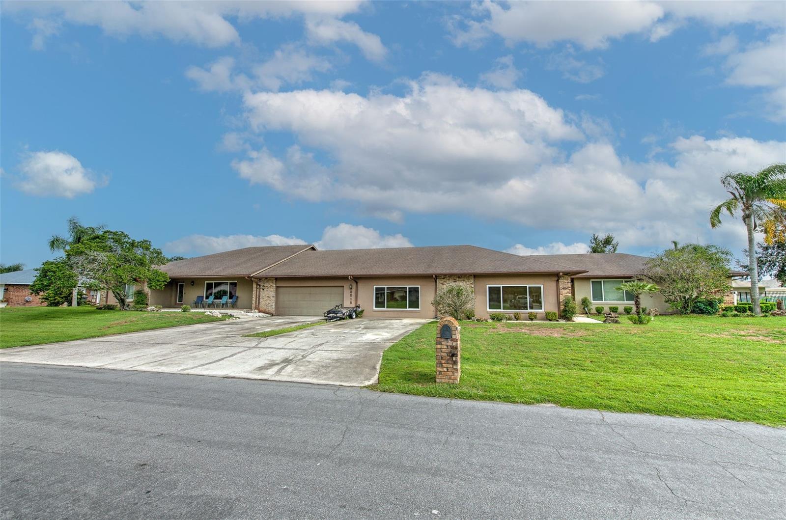 One-of-a-Kind Central Lakeland Home on Over ½ Acre – Ideal for Large or Multi-Generational Living. This unique and spacious home offers over half an acre of versatile living space in the heart of Central Lakeland. Designed with flexibility in mind, it’s perfect for large families or multi-generational living. The expansive main living area flows seamlessly into the updated kitchen, creating the ideal setting for family gatherings and entertaining. Renovated in 2017, the kitchen features a farmhouse apron sink, stainless steel appliances, double wall oven, separate oven/range, and an abundance of 42" cabinets with crown molding. The oversized center island is a natural hub for conversation and connection. Sliding glass doors lead to a sunroom that offers peaceful views of the pool and backyard — the perfect space to unwind. Down the hall, two oversized bedrooms share a spacious Jack-and-Jill bathroom complete with dual sinks, a soaking tub, separate shower, large walk-in closet, and linen closet. One of these bedrooms includes direct access to the pool area. A separate full bath is located off the main living area, along with a laundry room for added convenience. At the center of the home is a stunning 29x12 dining and entertainment space featuring a wet bar, built-in cabinetry, and a wall of picture windows overlooking the pool — an entertainer’s dream! The luxurious master suite is a private retreat, boasting a spa-like en-suite bath with dual body jets, rain head shower, frameless glass enclosure, freestanding tub, dual vanities, and private toilet. Barn doors open to a massive walk-in closet that’s truly every woman's dream. A second laundry room is located just off the master suite for added convenience. Additional living spaces include another large family room, two more bedrooms, and a beautifully updated bathroom. A second sunroom offers a quiet place to relax and recharge. Need more space? This home delivers — with a separate study, a craft room, a utility room for pool and lawn equipment, and more. Step outside to your personal outdoor oasis featuring a huge 20x40 pool and an expansive patio perfect for entertaining family and friends. This home truly has it all — space, flexibility, style, and comfort. Must see to fully appreciate!