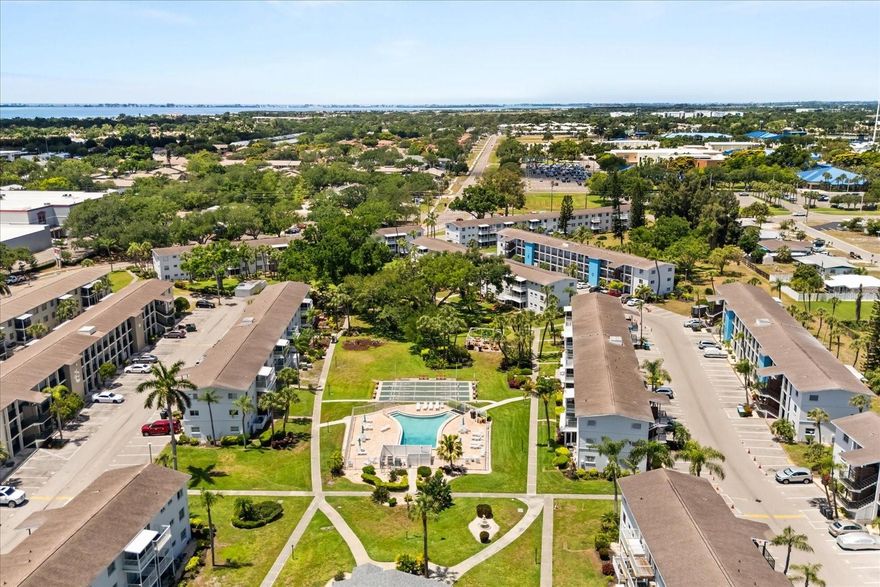 **RARE Perfectly remodeled turn-key condo that's Fully Furnished!** This charm presents an incredible opportunity for buyers seeking a move-in ready residence in this prime Florida location. This fully remodeled condo combines charm with modern upgrades, making it an ideal retreat or investment property. 

Step inside to discover a beautifully renovated interior featuring fresh paint, new flooring, and ultra-modern finishes throughout. The kitchen boasts newly upgraded countertops and cabinetry, complemented by new appliances that marry style and functionality. All cookware and cutlery included, this place is ready for you. The family room and dining area have been thoughtfully upgraded to create a welcoming, versatile space perfect for entertaining friends or relaxing after a day at the nearby beaches or community pool. The cozy bedroom offers ample closet space and a peaceful ambiance, ensuring restful nights. The bathroom has been upgraded with new countertops, fixtures, and vanity, adding to the home’s modern appeal.

Step outside to enjoy the private back patio, ideal for outdoor dining, relaxing in the Florida sunshine, or soaking in the tranquil surroundings. The view of the park with huge banyon tree makes it feel really special. The 2022 A/C system ensures the home stays cool and comfortable, while the 2024 water heater guarantees reliable hot water. There's a bonus storage room on the exterior hallway of this same floor, perfect for storing your beach gear. Elevator right down the hall. The exteriors of all buildings in the community were just renovated in 2025-2026 as well- Sharp modern-looking community. 

Community amenities are outstanding, with a reasonable HOA fee granting access to a refreshing pool, lush park with gardens, shuffleboard courts, and a vibrant community hall and office that hosts numerous activities. This friendly neighborhood fosters a welcoming atmosphere perfect for both relaxation and social engagement. Located close to everything Bradenton has to offer—including beautiful beaches, shopping, dining, and the international airport—you’ll enjoy a truly convenient lifestyle.

This exceptional condo combines modern upgrades, a fantastic location, and vibrant community living. Whether you’re looking for a vacation retreat, a year-round residence, or an investment opportunity, this property ticks all the boxes. Don’t miss your chance to own this beautifully upgraded Florida condo—schedule your private tour today and experience the perfect blend of comfort, style, and community living in Bradenton before this rare beauty is gone!