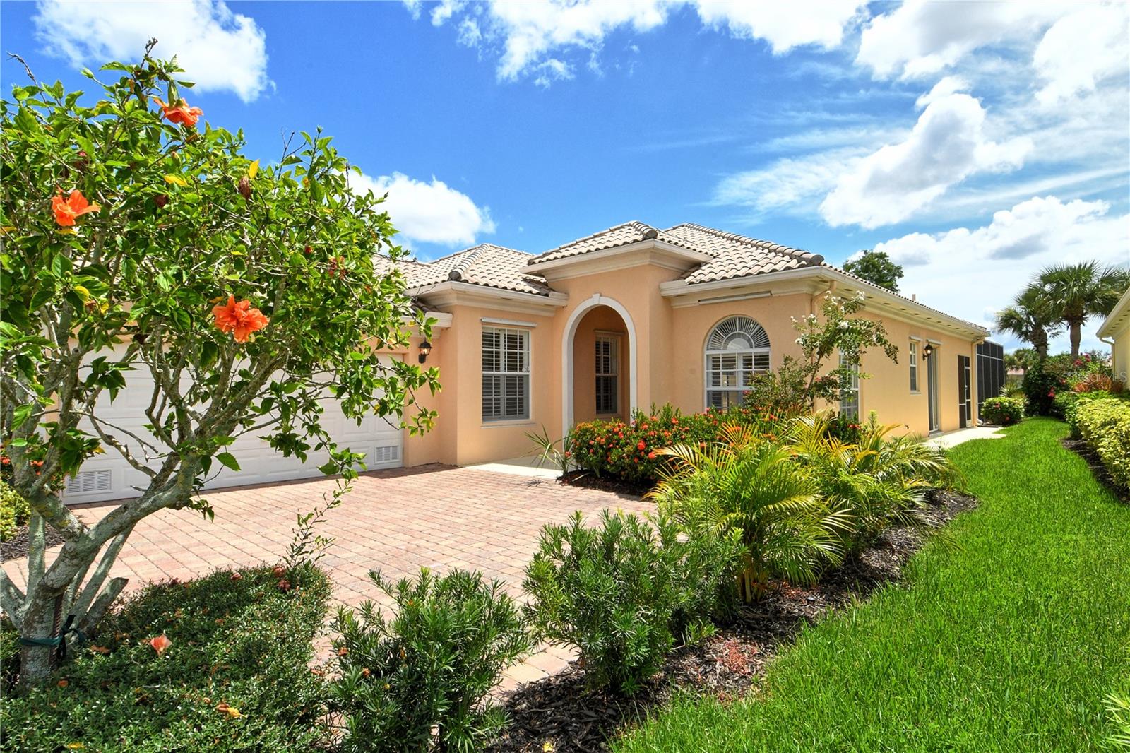 Only Oakmont currently available with private pool/spa & water views. Over 2000 sq. ft. Featuring 3 bedrooms & 3 baths. This very popular free standing maintenance free home in Villagewalk has numerous recent upgrades. Custom pool/spa package situated on large screened lanai overlooking a private pond. Lanai fridge/freezer to keep drinks & snacks cool when you entertain guests in the pool. Sellers have added updated appliances, granite counters, tile back splash & updated pool/spa heater. Main living area has neutral tiles which were professionally cleaned & sealed. All bedrooms feature bamboo wood flooring. Side entry garage with finished floor. This home is situated far from I-75 noise. Ready for a quick occupancy. Community features resort style living with amenities including 2 heated pools, 6 har tru tennis courts, fitness center, clubhouse, restaurant, salon & gas station with walking or biking paths throughout community along the many lakes, preserves & bridges with 24 hr. security gate with guard. Centrally located on Popular Palmer Ranch near shopping, restaurants, YMCA, Legacy Bike Trail, beaches & easy access to I-75.