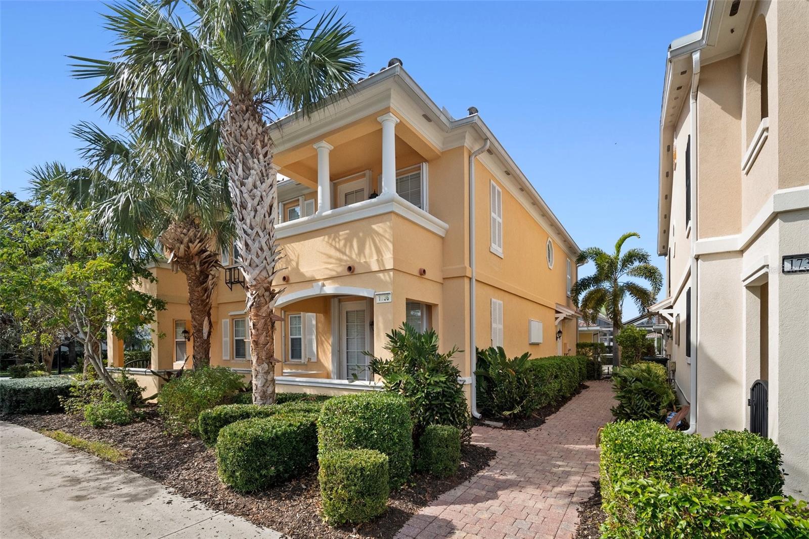 Wake up in Paradise! Well maintained Cayman townhome located in the Resort style community of Isles of Sarasota. An open floor plan with a double primary bedroom arrangement upstairs and a third bedroom on the first floor. The great room has a relaxed coastal feel with neutral walls, tile flooring and custom wall unit. The kitchen has corian countertops, newer appliances, pantry, and ceramic tile floors. The first-floor bedroom has carpet, a walk in closet and full bathroom. Upstairs the primary bedroom has carpet and a full bathroom with walk in closet. The double primary bedroom has a walk-in closet, an ensuite bathroom with shower and soaking tub. You can enjoy your morning coffee on the private porch right outside the second primary bedroom. Second floor laundry room with cabinets for storage and utility sink will make laundry day a breeze. Spend time swimming in your private pool with screened lanai. Additional features include central vacuum, brand new screens in the lanai, newer washer, dryer and a security system. HOA fees include internet, security, ground maintenance, irrigation, and landscaping. The Isles is an amenity rich Resort community with a geothermal heated Resort Pool, state of the art fitness center, Clubhouse, 4 Har tru lit tennis courts, basketball, pickleball and a playground. A full calendar of activities and events to enjoy! Onsite manager and lifestyle director. Close proximity to Siesta Key beach, Legacy Bike Trail, Costco and Publix.