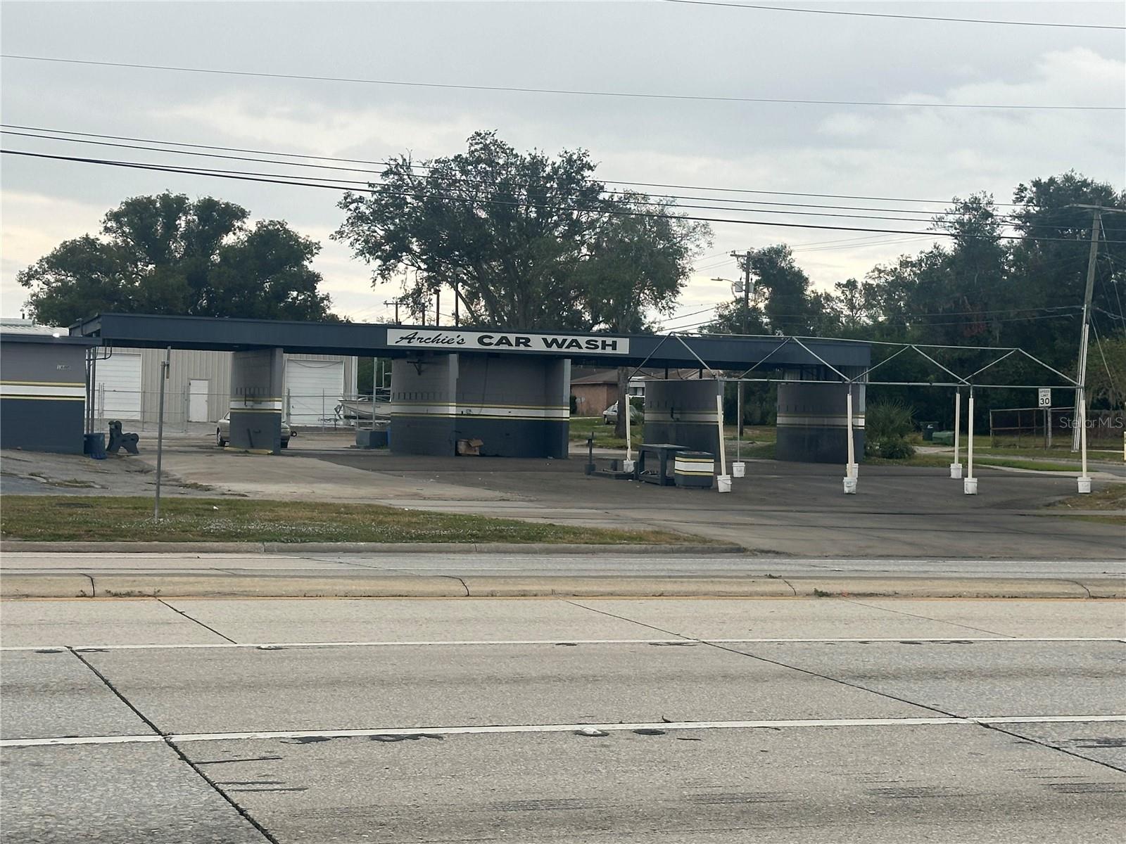 Prime commercial property at 1605 W Memorial Blvd, Lakeland, FL, offering 2,910 sq. ft. of space on a 0.5-acre lot. This high-visibility corner location is perfect for various business opportunities.