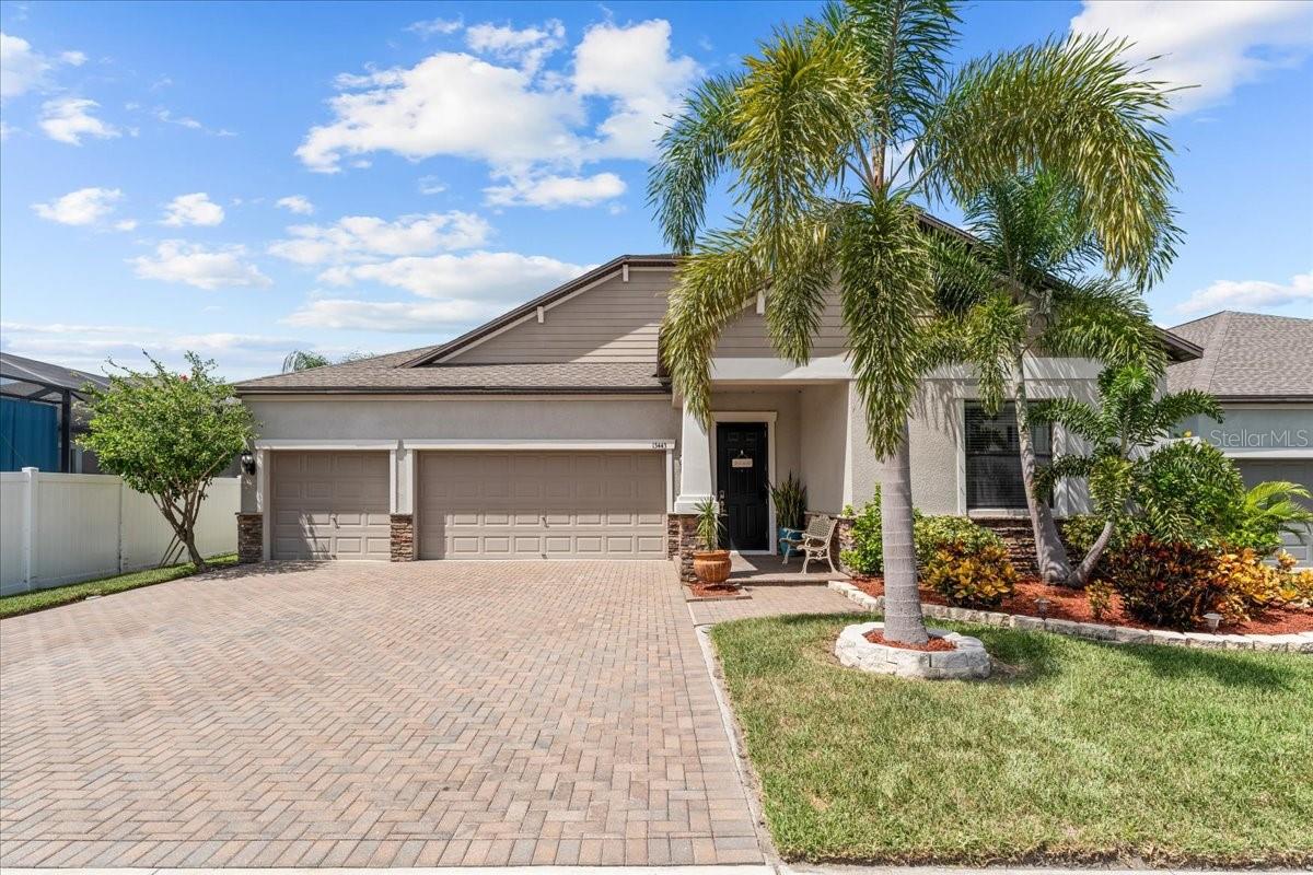 Come see this POND front, 4BR, 3BA, 2 FLEX AREAS, 3 CAR GARAGE, 2727SF home built in 2018. Elegant exterior brick accents and brick paver driveway leads you into this showcase home! The 3-way split bedrooms gives the privacy you want with an open concept design for family space. 17" x 17" ceramic tile laid on diagonal throughout the home with carpet in the bedrooms. 10ft high CEILINGS, 8ft high DOORS, upgraded lighting, upgraded ceiling fans and crown molding throughout. The separate formal dining room flexes into an office, playroom, or whatever your needs may be. The secondary flex area with built in granite desk and cabinets make for a great small office area. Gourmet kitchen with 42” Espresso wood Cabinets including pull out shelving and gorgeous white QUARTZ countertops and oversized island overlooking the family room. Reverse osmosis water filter system. STAINLESS appliances and eat-in kitchen with sliders to the lanai. Butlers Pantry with separate bar area and huge walk in pantry. Entertain with the open kitchen and family room combination with TRIPLE SLIDERS to the covered lanai area overlooking the pond. BILLIARDS TABLE and accessories included! Westward view for beautiful sunsets. Master Bedroom with roomy master bath featuring DUAL GRANITE SINKS, garden tub, separate shower and BIDET in the water closet. Large walk-in closet is conveniently connected to the laundry room. Separate bedroom with private hall bath. In the front of the home is two additional rooms with a Jack and Jill bath. Full house water softening system. ADT security system in place. RESORT STYLE amenities include pool, basketball, BBQ grilling, multiple parks, playgrounds, dog parks, and walking trails. Shopping and restaurants close by.