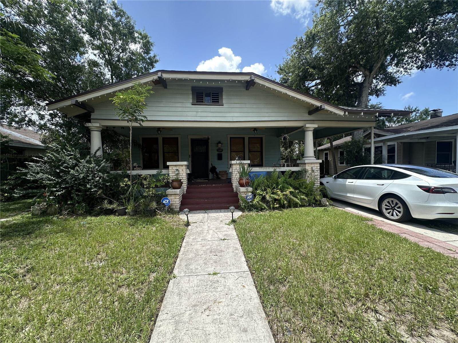 Charming Craftsman Bungalow with Income Potential in the Heart of Seminole Heights!
Welcome to this beautifully preserved and spacious 3-bedroom, 2-bathroom home with a bonus room, detached garage, and rare opportunity for additional income. Nestled in one of Tampa’s most sought-after neighborhoods, this classic bungalow blends timeless character with modern functionality.
At the front of the home, you’ll find two generously sized bedrooms and a full bathroom featuring one of two stunning clawfoot tubs. A versatile bonus room offers the flexibility to serve as a 4th bedroom, home office, playroom, or creative studio—whatever suits your lifestyle.
The private Owner’s Suite, tucked away at the back, includes a luxurious bathroom with dual vanities and a second clawfoot tub, a massive walk-in closet, and even a kitchenette with a private exterior entrance—ideal for use as an Airbnb or guest suite.
The heart of the home is the chef-inspired kitchen, outfitted with solid maple cabinetry, granite countertops, stainless steel appliances, gas range, walk-in pantry, eat-in dining space, built-ins, and a deep farmhouse sink—perfect for everyday living and entertaining alike.
Throughout the home, enjoy authentic bungalow charm: an oversized front porch with classic swing, newly refinished antique heart-of-pine floors, wood-burning fireplace, picture rails, craftsman-style doors and trim, and thick 7-inch baseboards. Stay comfortable year-round with a brand-new HVAC system installed in July 2021, and enjoy a fresh interior paint job completed just for you.
Step outside to a serene backyard retreat featuring mature landscaping, brick pavers, a shaded pergola, fire pit, privacy fencing, and ample space for boat storage or gardening. The detached garage offers endless possibilities—use it as a workshop, art studio, or additional storage.
Ideally located just minutes from Tampa’s best restaurants, breweries, and shops in the Heights, with quick access to I-275, I-4, Downtown, Armature Works, Ybor City, SoHo, and Tampa International Airport.
Motivated sellers—schedule your private tour today and discover why living in a Seminole Heights bungalow is truly something special!