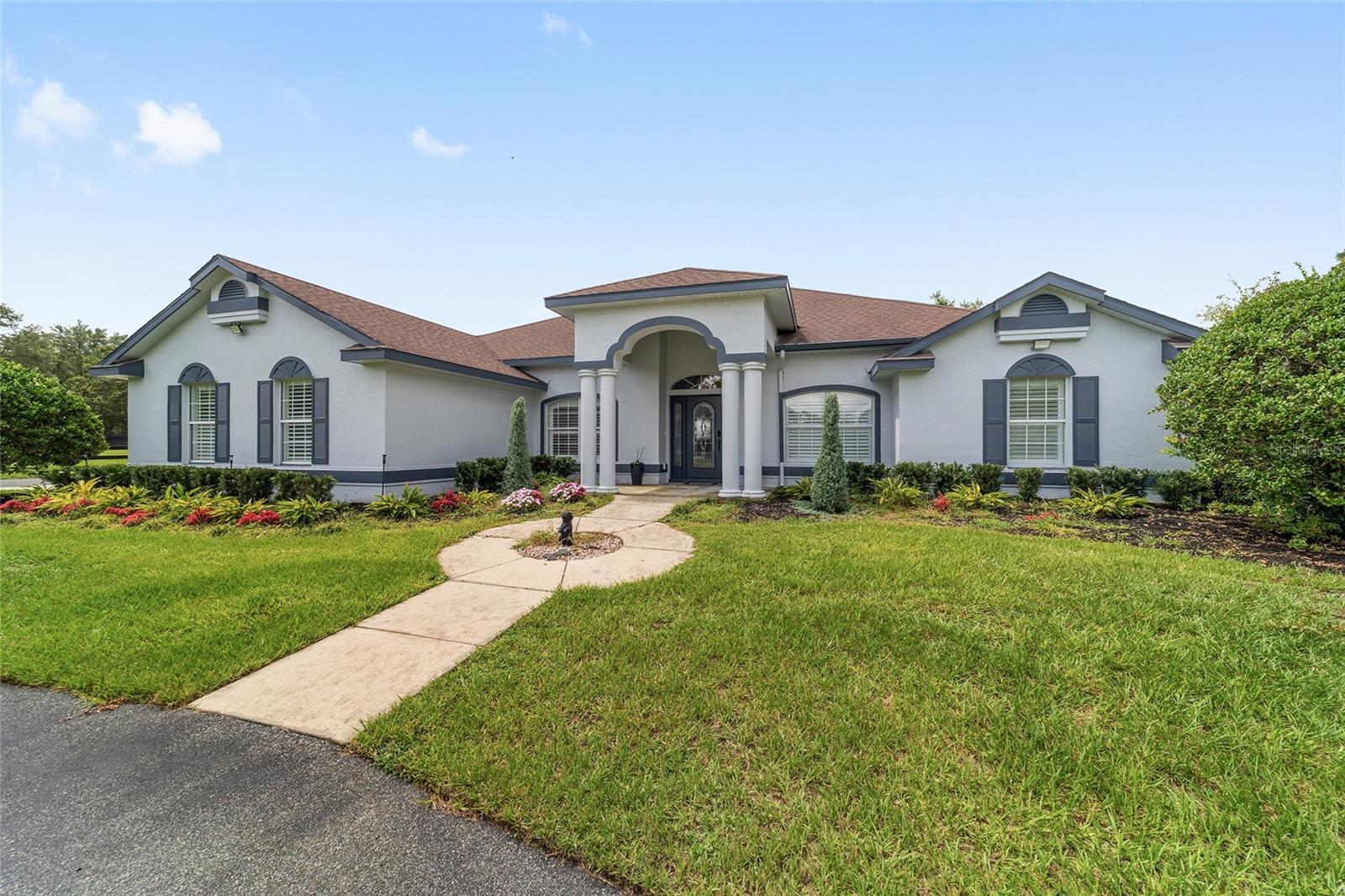 This beautiful 6+ acre farm is located just minutes to WEC, in the gated community of Saddelbrook Equestrian Park. The community provides the perfect place to live your equestrian dream including a beautiful bridle path around the community for endless riding opportunities. This beautifully updated farm welcomes you with its grand gated entrance and circular driveway. The delightful home was just completely renovated and updated with all new finishes, large format tile throughout the home, new wall of cabinets in the kitchen, walk in pantry and a 14 foot island that can seat 8 with double sided cabinets for tons of storage. Quartz countertops in the kitchen, baths and laundry. New appliances with 48” built in refrigerator, beverage and wine cooler, and induction stove top. Master bath is a true spa experience with a 3 person sauna and large walk in shower with room for 2 shower heads and floor to ceiling shower glass walls. Master bedroom has 2 large walk in closets and all 4 bedroom closets have new built in shelving and storage. New washer and dryer in the laundry room with full built in utility cabinets. Plantation shutters and solid wood 3 panel doors throughout. You will fall in love with the light and bright, open floorplan. The home also has a separate office/den space and lovely screened patio overlooking the farm landscape. Your horses will also enjoy all of the comforts of the 7 stall center-aisle barn features auto water in each stall, fly spray system, tack and feed rooms, and also provides a covered area for equipment storage. The farm also features a second 2 stall barn complete with a nice tack room and oversized stalls. The acreage is fenced and currently has 4 large paddocks with plenty of room to add an arena if desired. Don’t miss this one of a kind property and experience the Florida horse lifestyle!