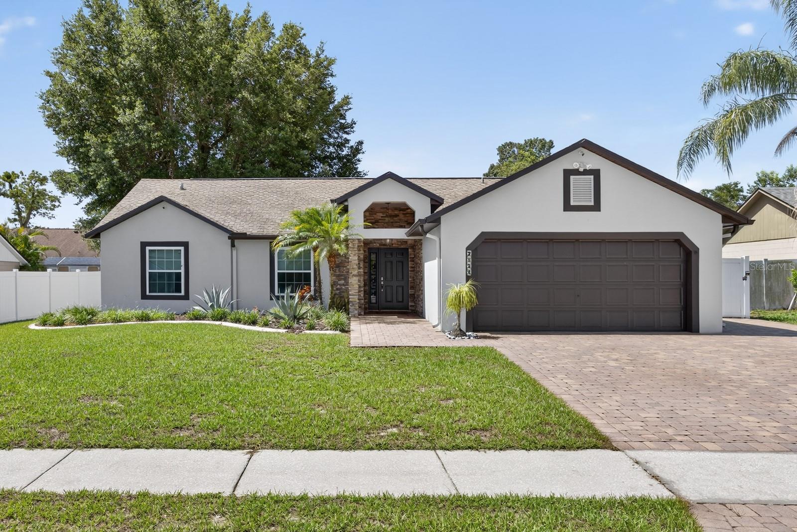 Under contract-accepting backup offers. Welcome to this beautifully maintained 3-bedroom, 2-bathroom home located in the sought-after community of Arbor Ridge. Nestled in an established neighborhood with mature landscaping and exceptional curb appeal, this cozy residence offers the perfect blend of comfort, style, and convenience.
The thoughtfully designed floor plan features a spacious primary suite complete with a walk-in closet and an upgraded en-suite bath. Two additional bedrooms share a full bathroom adorned with modern upgraded tile, making this home ideal for families or guests.
At the heart of the home, the kitchen boasts granite countertops, a stylish tile backsplash, new stainless steel appliances, and recessed lighting—perfect for both everyday living and entertaining. New ceiling fans have been installed in all bedrooms and the living room for added comfort.
Energy efficiency meets modern convenience with new double-pane windows throughout the home, all equipped with power shades. Step outside through sliding glass doors to a screened-in lanai, perfect for enjoying Florida evenings. Beyond the lanai, you’ll find a fenced backyard—ideal for pets, play, or gardening.
Additional highlights include an extended paver driveway with ample space for multiple vehicles, and a lush, landscaped front yard that enhances the home’s welcoming exterior.
Located just minutes from UCF, Valencia College, Full Sail University, and with quick access to 417, Arbor Ridge offers the perfect combination of tranquility and convenience. Zoned for top-rated neighborhood schools, this home is ideal for first-time buyers, growing families, or anyone looking to settle in a peaceful, well-connected community.
Don’t miss your chance to own this gem—schedule your private showing today!