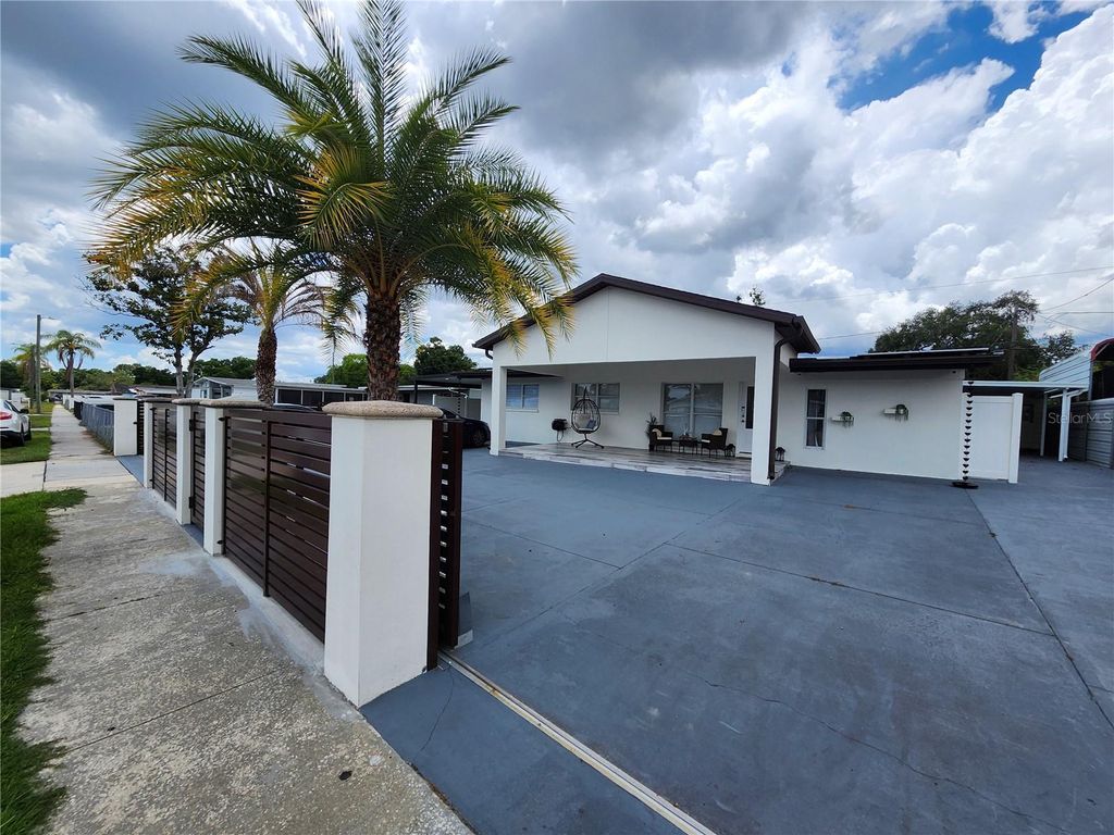 Photo of 7514 Paradise Place, Tampa, FL 33619 (MLS # TB8525229)