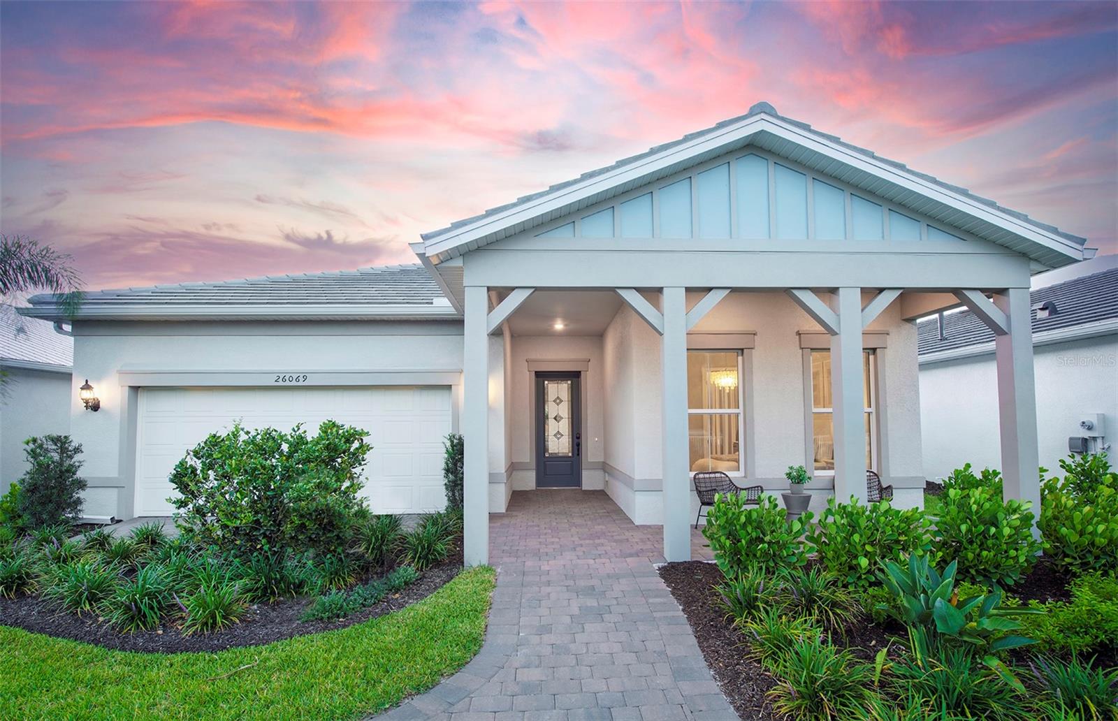 Welcome to the beautifully upgraded Prestige floorplan—a stunning 2-bedroom, 2.5-bath home with a spacious den, thoughtfully designed for both comfort and style. This residence offers an impressive array of high-end features, including a 4-foot garage extension and a screened-in pool and spa, perfect for Florida living. Inside, enjoy seamless flow with elegant 12x24 tile flooring throughout, 8' interior doors, and upgraded 5" baseboards. The open-concept gathering room boasts a tray ceiling, adding a touch of architectural elegance, while the French doors off the den provide both privacy and charm. The gourmet kitchen is a chef’s dream, complete with built-in appliances, quartz countertops, and crisp white cabinetry. Outdoor living is elevated with an extended covered lanai and pre-plumbing for an outdoor kitchen—ideal for entertaining. The primary suite features a luxurious large walk-in shower, while the laundry room is fully upgraded with cabinets, countertops, and a utility sink. Smart home technology is also included, offering modern convenience at your fingertips. The amenities features 21 sports courts including pickleball, tennis and bocce ball, a resort style pool with a beach entry and attached lap pool with multiple swim lanes, boardwalk with a kayak launch, memorial garden, community garden, dog park, miles of trails, gated entry with guard, second gate to Manasota Beach road, full time activity director, and an 11,000 sq ft fitness center featuring a cafe and bar and grille. Tiki Bar is open and indoor formal restaurant to open in the next 6 months.
