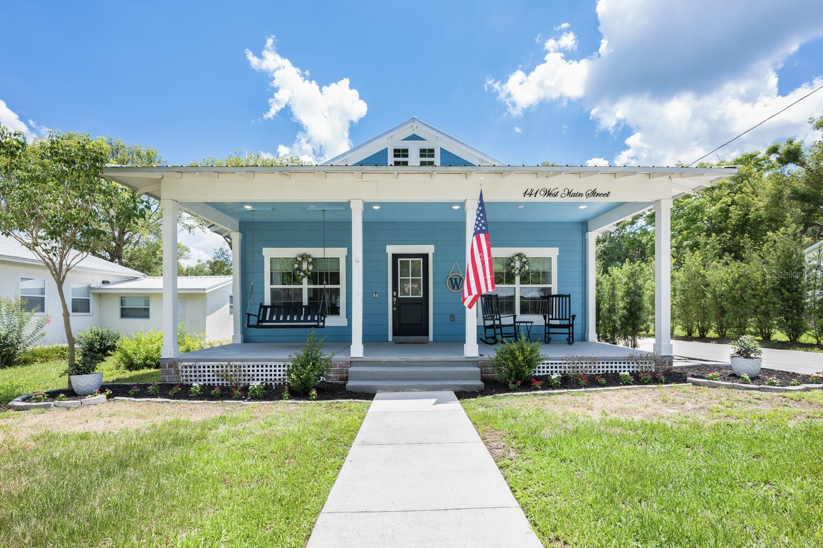 Seller may consider buyer concessions if made in an offer**Experience modern comfort and Southern charm in this IMMACULATELY MAINTAINED 3-bedroom, 2-bathroom home with 1,889 SQUARE FEET of single-story living in the heart of Lake Helen. Just FOUR YEARS YOUNG, this beautifully designed home features vaulted ceilings, an ENERGY-EFFICIENT metal roof that eliminates worries about shingle loss during Florida storms, and an abundance of DOUBLE-PANE WINDOWS that fill the interior with natural light. You'll love the LARGE COVERED FRONT PORCH, complete with a swing—perfect for relaxing and enjoying the peaceful, friendly neighborhood. Inside, the OPEN LAYOUT is filled with thoughtful upgrades and modern fixtures, including a SMART THERMOSTAT, SMART IRRIGATION SYSTEM, and a mud room for everyday convenience. The kitchen is a showstopper, offering a SPACIOUS CENTER ISLAND with counter-height seating, sleek cabinetry, quartz countertops and a built-in WINE REFRIGERATOR—ideal for entertaining. The primary suite offers a private retreat with an EN SUITE BATHROOM containing a private water closet, dual sinks, walk-in shower and plenty of space to unwind, while two additional bedrooms provide comfort and flexibility. A BONUS ROOM, ideal for a home office or creative space, opens through FRENCH DOORS directly onto the back patio, enhancing your indoor-outdoor lifestyle. The fully fenced backyard features vinyl fencing, a handy storage shed, and plenty of room to enjoy outdoor living. The EXTRA-LONG DRIVEWAY offers ample parking for your RV, golf cart, or boat—and with NO HOA, you’ll enjoy the freedom to truly make this home your own. Located just blocks from local coffee shops and ice cream stores, you’ll love the SMALL-TOWN CHARM of Lake Helen, where community events like parades, the Strawberry Festival, and seasonal celebrations bring neighbors together. Enjoy LAKE ACCESS for fishing and kayaking, and explore local favorites like the Lake Helen Equestrian Center and the Butler Express Train ride. This home isn’t just a place to live—it’s a lifestyle. Come see what makes this LAKE HELEN GEM so special!