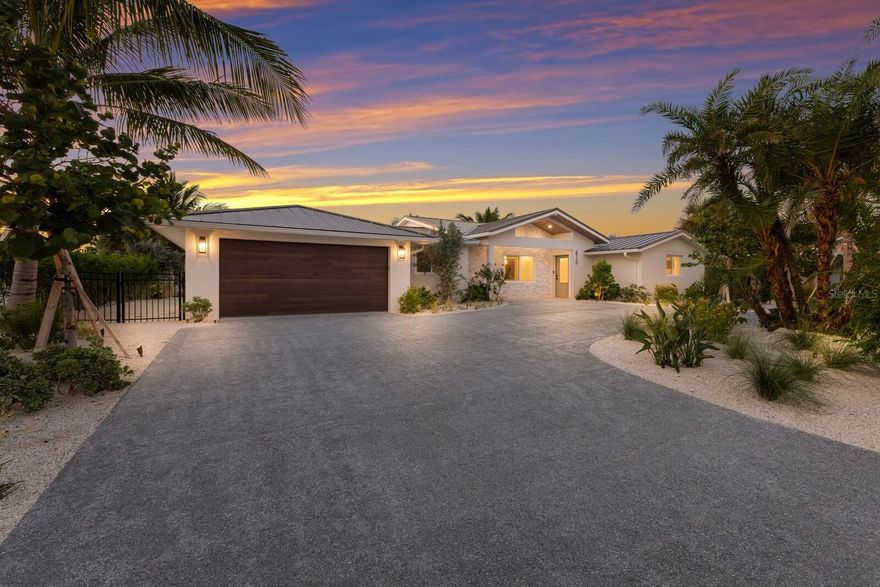 A coastal masterpiece tucked within the prestigious Key Royale community on Anna Maria Island, this spectacularly reimagined 4BD/4.5BA waterfront residence offers over 90 feet of tranquil canal frontage with a newly constructed dock and seawall, and a rare blend of intentional design and elevated island living. Every inch of this home has been thoughtfully crafted with extraordinary attention to detail, where warm textures, natural materials, and curated finishes work in harmony to create a space that feels as refined as it is welcoming. The striking kitchen is anchored by richly toned cabinetry, Thermador appliances, wet bar/coffee station and an expansive quartz waterfall island, while designer lighting throughout the home brings atmosphere and cohesion to each room. Vaulted tongue-and-groove ceilings, arched stone accented transitions, and sculptural elements add a layer of architectural interest. Each bathroom is a statement in itself, with moody tile work, brass fixtures, and spa inspired features like a freestanding soaking tub set within the shower enclosure. Additional amenities include smart home technology seamlessly integrated through a Control4 system, outdoor speakers, PGT impact-rated windows and doors, all new MEPs including sewer, and the Easy Damn Flood Barrier System offering peace of mind. Step outside into your private oasis, where lush landscaping surrounds a stunning resort-style pool and spa, coral stone outdoor shower, covered lounge space, an oversized dock with seating area and direct access to Tampa Bay. Residents of Key Royale enjoy the option of joining the private Key Royale Club offering golf, dining, and social events. With monthly rental zoning in place, you’ll have added flexibility whether this is your full-time sanctuary or part-time escape. Don’t let this coastal slice of island life slip away and make it your dream escape today!