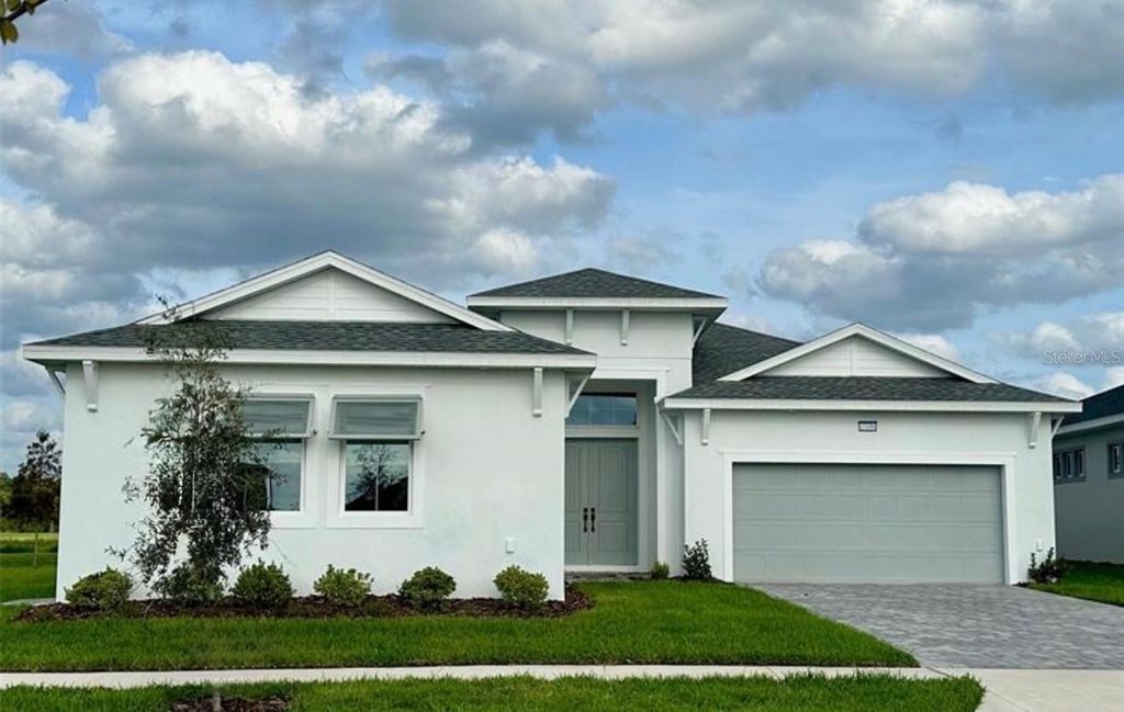 Photo of 10496 Purple Thistle Way, San Antonio, FL 33576 (MLS # J986207)