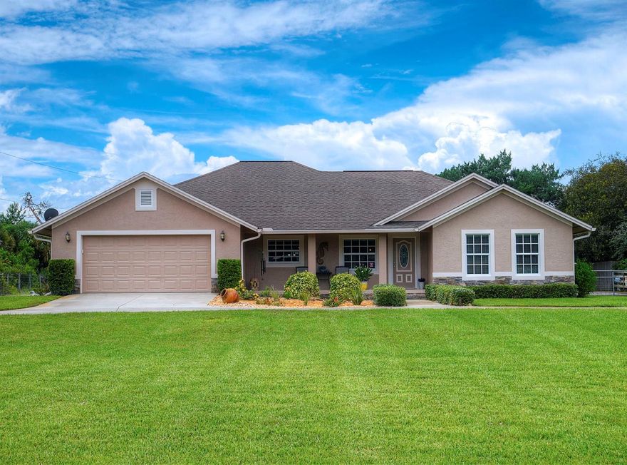 A home for you & all your stuff.  Need space for your RV, cars, boats & tools or pets, this property has room for it all!  Dual paved driveways lead the way to this bright cheerful 3 bedroom 2.5 bath home & its serene 2.5 manicured acres that are partially fenced & include a pasture that could be the perfect home for your horses.  This large estate type property can power all your toys with two 50 amp & one 30 amp hook-ups and can be stored in your choice of the attached 2 car garage, the 4 car 2 bay garage/workshop complete with ½ bath, OR the under the oversized carport.  This outdoor haven even offers a screened in living area for the perfect summer BBQ.  The main house is constructed of efficient concrete block and offers a desirable split bedroom floor plan with large rooms, indoor laundry, and tile flooring throughout.  The kitchen boasts a large easy to work in floorplan and the custom stone breakfast bar overlooks the breakfast nook and expansive back yard.  Large triple sliding glass doors from the living room lead to a comfortable screened enclosed back porch that can also be accessed from the master bed and bath which is complete with walk-in closets, double sinks & custom tiled walk-in shower.  This country paradise may feel remote, but it's also conveniently located to all the creature comforts of this city including, shopping, entertainment, and schools. Surrounded with mature landscaping & peaceful atmosphere this picturesque property has it all and with room for all your stuff! ;Water: City