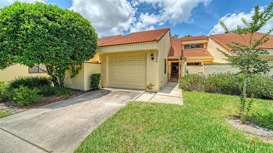 Located in sought-after The Meadows, this adorable 3-bedroom, 2.5-bath villa with a coveted GARAGE offers comfort, charm, and stunning golf -course views surrounded by mature landscaping. The updated kitchen features newer granite countertops, stainless steel appliances, and convenient access to a darling private courtyard through sliding glass doors — perfect for morning coffee or casual outdoor dining. The spacious combination living and dining area boasts high ceilings and multiple sliding doors that fill the home with natural light while seamlessly connecting indoor and outdoor living spaces. Relax on the back porch overlooking the golf course or unwind in the covered and screened lanai, an ideal setting for afternoon reading or meditation. The primary suite is conveniently located on the first floor and includes an en-suite bath. Downstairs also features a laundry closet and adjacent half bath for guests. Upstairs, you’ll find two additional bedrooms and a full bath, offering plenty of space for family or out-of-town guests. This amenity-rich community offers a pool, tennis, fitness center, golf, and so much more. Conveniently located just minutes from University Town Center for shopping and dining, and close to Nathan Benderson Park with walking trails, biking paths, and year-round events. A wonderful opportunity to enjoy the Florida lifestyle in an unbeatable location!