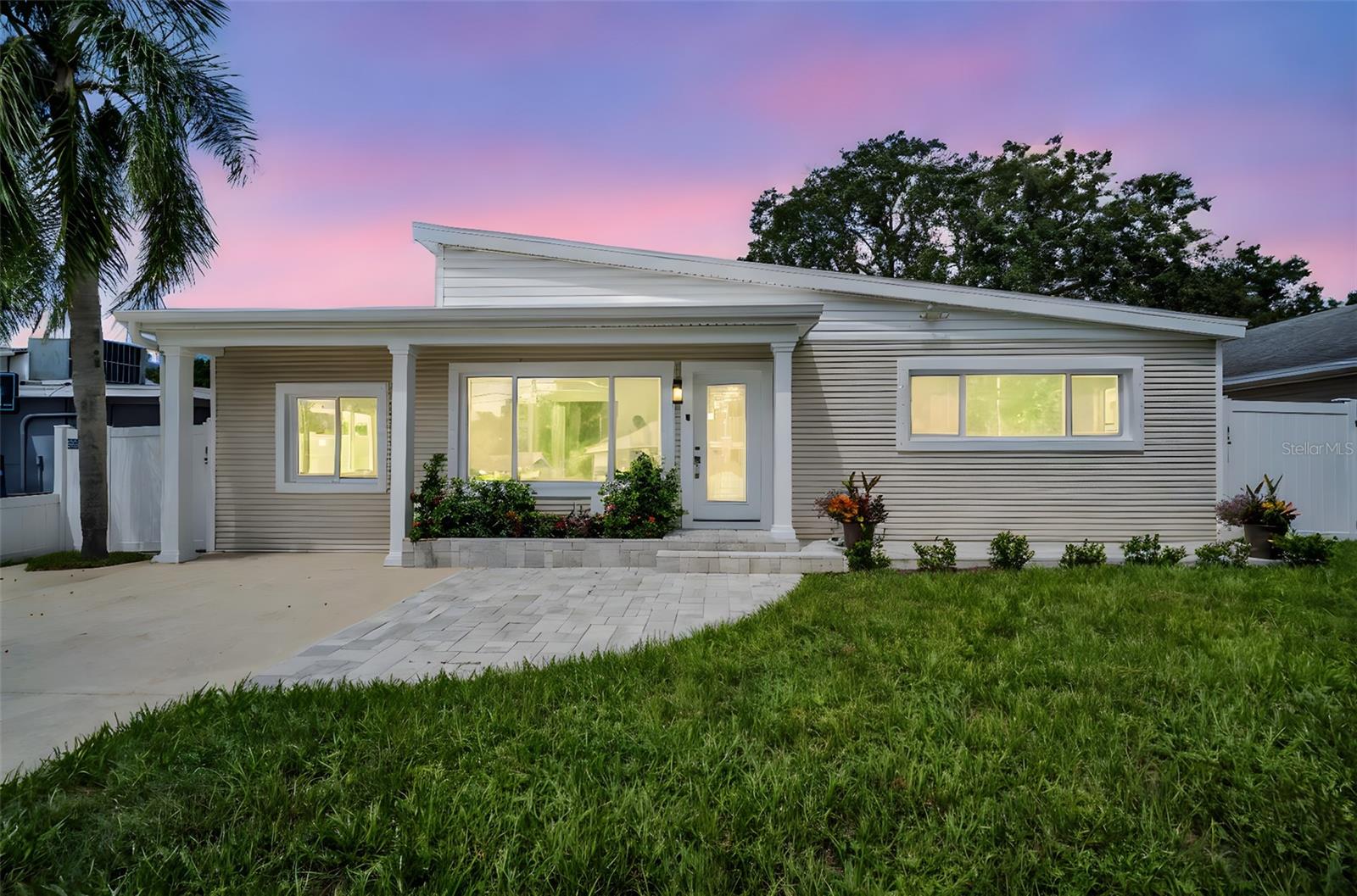 One or more photo(s) has been virtually staged. Fully Renovated 4-Bedroom in Tarpon Springs – Minutes from Beaches & Sponge Docks! Step inside and experience the feel of a brand-new, move in ready, beautifully renovated 4-bedroom, 2-bath residence. Every detail has been thoughtfully updated from top to bottom, including a NEW ROOF, NEW AC, brand-new appliances, porcelain tile throughout, new windows with hurricane protection, fresh interior and exterior paint, all-new doors, trim, light fixtures, and an upgraded electrical panel. The spacious layout features generously sized bedrooms, with the primary suite offering a private full bath and oversized walk-in closet and the second bedroom also featuring a walk-in closet. Both bathrooms have been tastefully modernized with designer finishes.
The floor plan of this home includes a living room, dining room as well as an oversized family room. Enjoy the convenience of an inside laundry room and abundant closet space throughout. Outdoors, you’ll love the all-new landscaping, huge, fenced yard with new vinyl fencing, and large back patio with new pavers. A storage shed adds functionality, while the spacious yard provides plenty of room for entertaining, gardening, or play. Best of all, this home has NEVER FLOODED and is ideally located just minutes from downtown Tarpon Springs, where you’ll enjoy First Friday festivals, concerts, shopping, dining, and the famous Sponge Docks are just a few blocks away. Outdoor enthusiasts will appreciate the Pinellas Trail nearby with over 50 miles of paved pathways, plus the area’s incredible water activities including boating, fishing, kayaking, and scenic boat rides to Anclote Key, Three Rooker’s Island, Honeymoon Island, and more. And of course, you’re just a short drive to beautiful Gulf beaches and local parks. This one truly checks all the boxes. Modern updates, spacious living, and an unbeatable location!