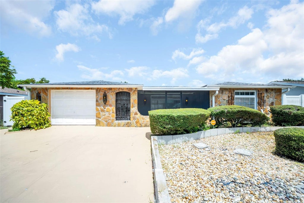 Photo of 7825 Bloomfield Drive, Port Richey, FL 34668 (MLS # TB8544181)