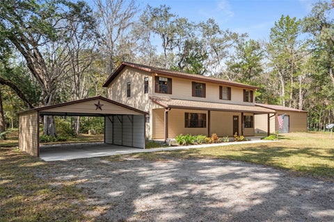 Photo of 12047 Timber Lane, Brooksville, FL 34601 (MLS # W7887509)
