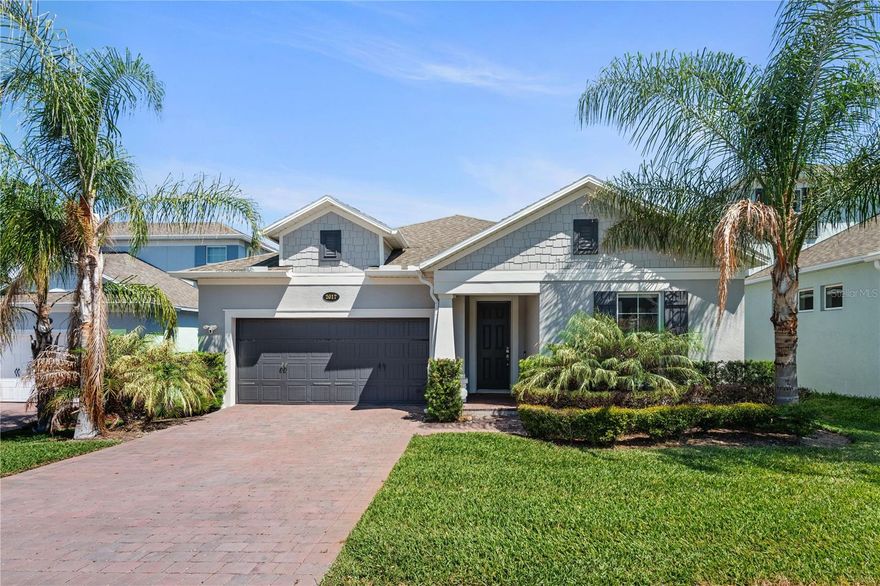 One or more photo(s) has been virtually staged. This meticulously maintained 2,852 sq ft, 4-bedroom, 4-bath home, built in 2022, is situated on a quiet street in the lakefront community of Hull Island in Oakland, with direct access to the West Orange Trail and just minutes from historic downtown Winter Garden’s shops and Saturday farmers market.
Designed for primarily single-level living, all four bedrooms—including the primary suite—are located on the first floor, along with the main living areas. Upstairs, a private bonus suite with its own full bath provides exceptional flexibility and easily functions as a fifth bedroom, media room, or guest retreat.
The open-concept floor plan is filled with natural light. Upon entering the elegant foyer, you’re welcomed into a seamless living space connecting the kitchen, dining area, and great room, all overlooking the backyard through three large sliding glass doors.
Step outside to enjoy Florida living on the covered and screened lanai with a private backyard—perfect for relaxing or entertaining.
The upgraded gourmet kitchen features a gas range, Bosch refrigerator, GE stainless steel appliances, quartz countertops, 42-inch cabinets stacked to the ceiling, and an oversized island with seating.
The first-floor primary suite offers a private retreat with a tray ceiling, dual vanities, a spacious walk-in shower, and a custom walk-in closet with direct access to the laundry room.
A major highlight of the home is the solar system (installed in 2023), helping keep electricity costs low, complemented by a tankless gas water heater for added efficiency.
Additional upgrades include pre-wiring for surround sound in the great room, a media-ready bonus suite with Cat6 wiring, a Ring doorbell, alarm system, cameras, and a 220V outlet in the garage for EV charging or workshop use.
Residents of Hull Island enjoy resort-style amenities including a community pool, clubhouse, playground, and a fishing pier.
This home combines modern design, energy efficiency, and a highly desirable location—offering both comfort and long-term value.
