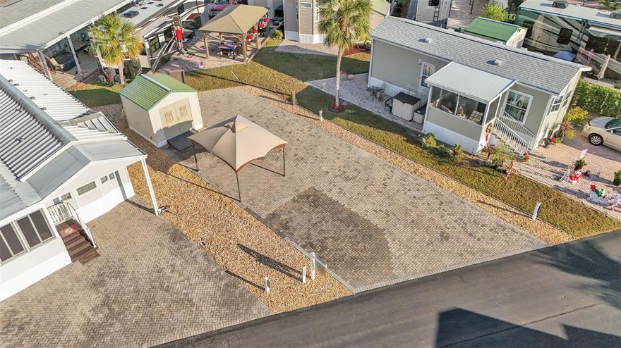 Low-maintenance living in the Florida Sunshine on your own upgraded RV pad in Elite Resorts at Citrus Valley! This popular community is located in Clermont, close to Disney (12 miles) and many Central Florida Attractions. Park and enjoy on an oversized paver pad, with parking area, gazebo and 10x10 storage shed. You'll have plenty of room for any size RV with 50 amp electrical service, water supply and sewer services on charming Citrus Tree Road. The community amenities are a big value with high speed internet, cable, sewer, trash, water, grounds maintenance, community pool, bathhouses, playground, gate, grass cutting and more included in your condo dues ($786 each quarter). Plus enjoy social events, beautiful weather, Bingo and many nearby attractions as part of the Florida lifestyle. Call today to set up your showing!