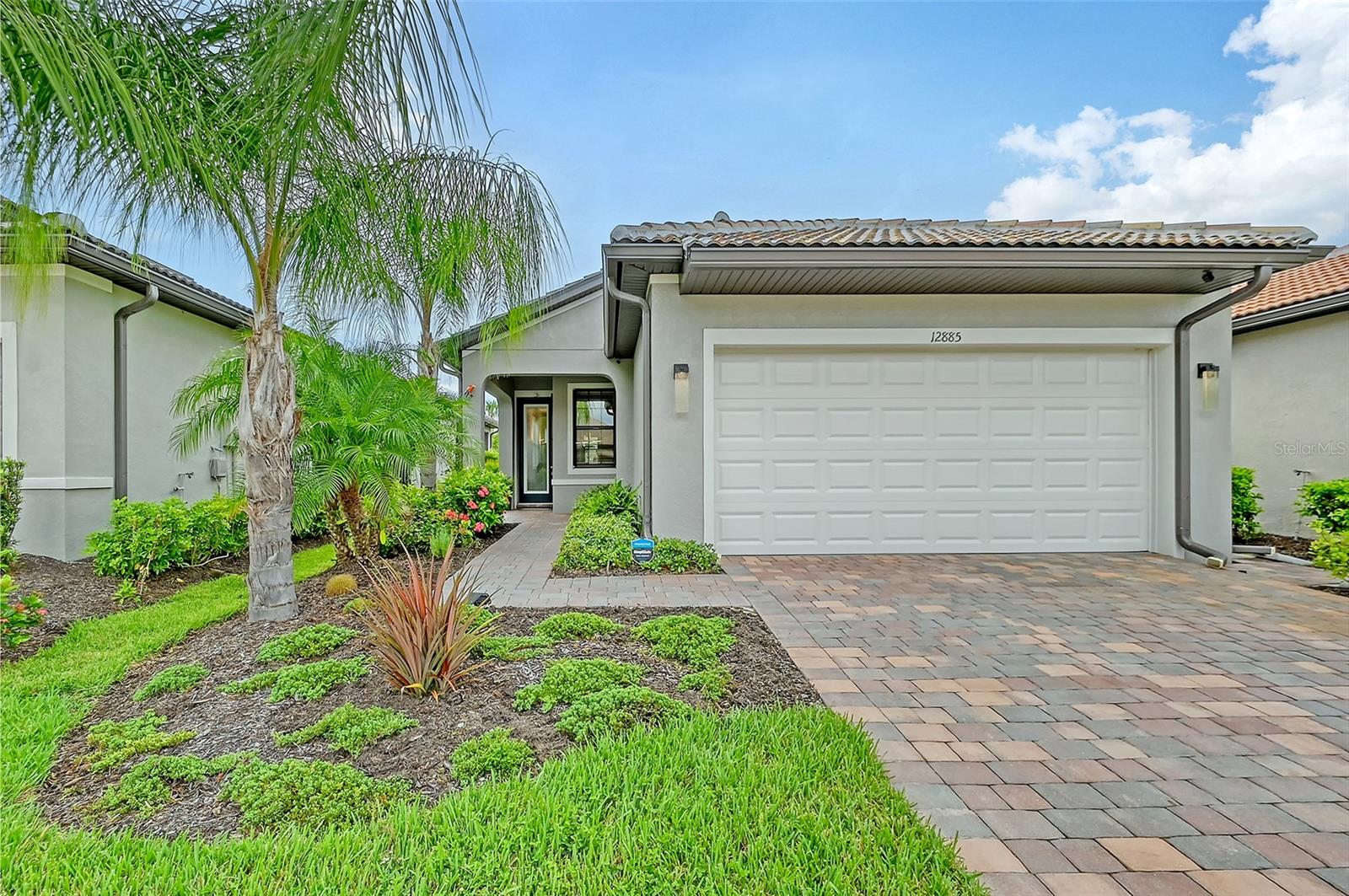 Enjoy resort style living in this open concept move in ready 4 year old home! The IslandWalk community is rich with activities where there is something for everyone. No need to worry about lawn care, weeding or tree trimming, it’s part of the package. IslandWalk is just 5 minutes from Wellen Park, Publix, Costco or Cool Today Park/Atlanta Braves stadium. Walk, bike or take the golf cart to get the most out of Florida’s beautiful environment and pleasant winter weather. This location is within 30 minutes to Gulf of Mexico public beaches and historic downtown Venice on the Island.
This home features 3 bedrooms and 2 bathrooms with spacious closets and generous storage. The kitchen features a convenient pantry, under counter lights, oversized island and quality Artistokraft white cabinets with granite countertops. Dependable stainless steel whirlpool side by side refrigerator and dishwasher, complement a 2-year-old Kitchenaide microwave and Fridgidare oven. The laundry room is equipped with top loading whirlpool washer and dryer.
The spacious master bedroom has plenty of room for a king bed. An en-suite bathroom has 2 sinks with granite countertops, walk in shower and a well-lit master closet. The second bedroom is conveniently located next to the 2nd bath. The third bedroom can easily be used for guests or office space, whatever fits your lifestyle. The closet is designed to be used either way.
Locking accordion hurricane shutters were installed in 2023. The entry door is impact resistant as well as the window in the master bathroom. The solid concrete block structure, tile roof and steel framing are built to last. The exterior of this home was professionally painted in November 2023. The exterior lighting was updated and is controlled by a timer switch located by the front door. This home was occupied full time and was climate controlled by a Lennox Elite HVAC system at all times. There were no pets or smoking inside and it is well ventilated.
Sit on the lanai and enjoy a cup of coffee and watch the sun come up over the butterfly garden. Monarch butterflies are frequent visitors along with yellow cloudless sulfur butterflies that find their home on a casia tree.
IslandWalk is a convenient and friendly community. When you are away, you can monitor the inside and outside with Blink cameras and a Simply Safe security system. The system monitors any activity within the range of the cameras as well as the internal and external temperatures. The system will send an alert to your phone so you can respond appropriately.
Last, but not least is a 2 car garage with 2 large metal shelving units. MyQ garage door is operated by an app on your phone. It can be opened or closed from any location with just 2 clicks. Also included are 2 remote controls. The epoxy floor is easy to maintain and resists dirt and stains. The water softener helps to keep appliances and plumbing in good working order.
Yes, there’s more! Schedule a tour and see for yourself!