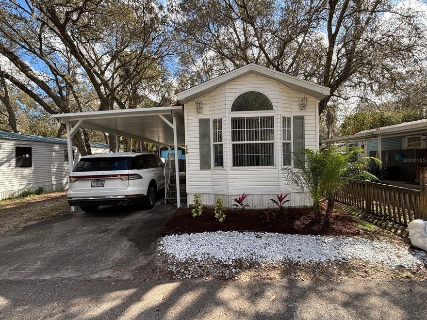 Lot ownership included! Charming and cozy 1-bedroom, 1-bath manufactured home located in the gated Yogi Bear’s Jellystone / Clarcona Resort community in Apopka. This well-maintained home features a convenient 1-car carport, a lovely outdoor deck, and an exterior storage shed for added functionality. The interior offers a warm, homey feel with comfortable living space ideal for full-time residence or a seasonal retreat. Residents enjoy community amenities including a swimming pool, clubhouse, playground, mini-golf, laundry facilities, bathhouse, and an on-site community grocery store. In-house property management adds extra convenience. Centrally located near shopping, dining, and major roadways for easy access throughout Central Florida. An affordable and adorable place to call home—don’t miss it!