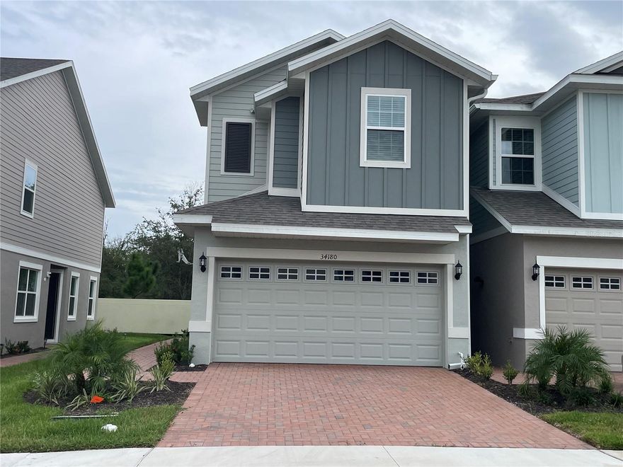 Larger brand new built end unit townhome with 3 bedrooms, 2 baths and a 2 car garage with gorgeous modern look and paver driveway. The down stairs all in tile has open kitchen area with breakfast nook leading out outside slider and patio. The living room is spacious with ½ bath. Upstairs there is an extra bonus space with all bedrooms and laundry area. The master bedroom has plenty of space for a king suit with huge walk in shower, dual vanity sinks and separate lavatory. The community has a pool, and beautiful sitting areas with large grandfather oaks. Not to mention located in WESLEY CHAPEL just minutes to I75, restaurants, entertainment, schools, and shopping. Home Depot and Publix is right around the corner.