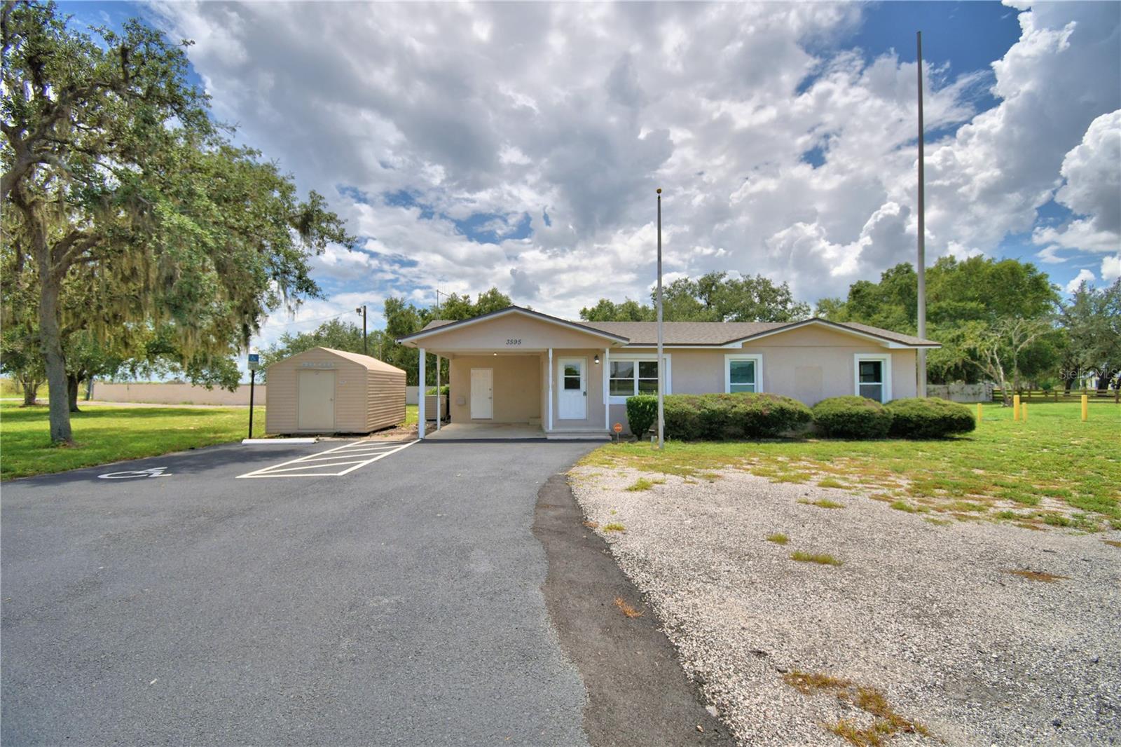 LOOK NO FURTHER......CORNER LOT PROPERTY on 1.86 ACRES and NO HOA! Property was previously owned by Polk County Fire Dept for the past 14 years. Current seller has never occupied the home. Home is 4B/2B with 2188 sq ft with LOTS OF POTENTIAL! Wood flooring throughout home and wood burning fire place in Living Room. Kitchen has all appliances that convey with the home. Large screened area outside back of house and area where pool is (but previously not used and filled with dirt) Property is fenced and LOTS OF ASPHAULT PARKING with a 30x30 Pole Barn, 2015 Storage Shed and covered 20x16 carport leading to outside 8x12 laundry room. BRAND NEW ROOF/MAY 2025. COULD BE YOURS! Seller would consider OWNER FINANCING. Call today for your schedule viewing.