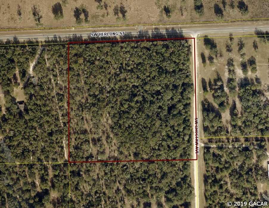 Naturally wooded 9 + acre corner lot. High and dry with paved road frontage on Herlong Ave and frontage on Choctaw Ave. Located in Southern Columbia County Florida, an area of homes, farms and recreational opportunities. Open Builder.