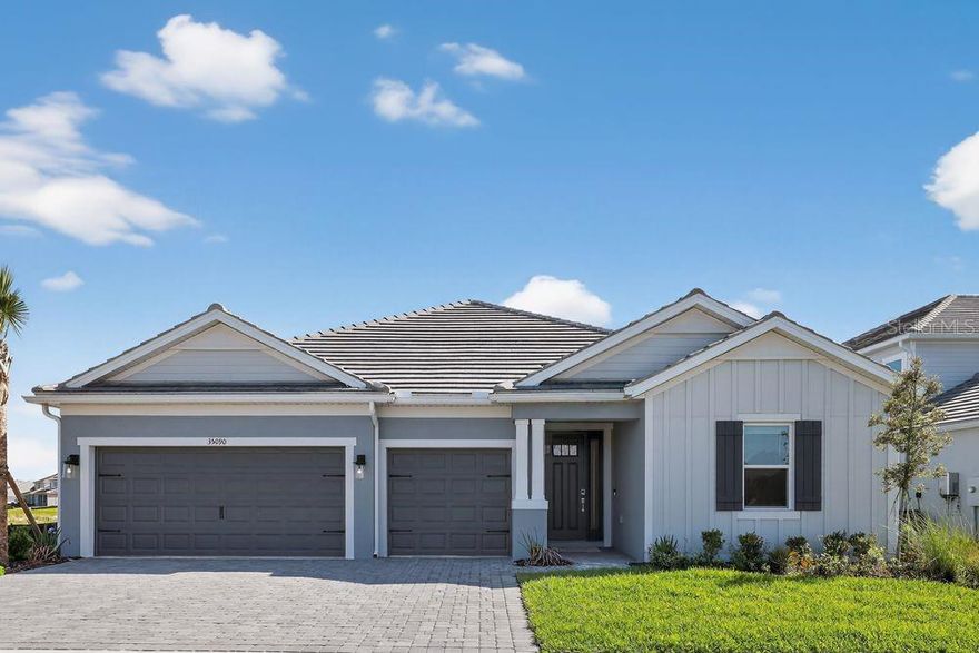 What's Special: Popular Plan | Oversized Pantry | Dedicated Study | Pond View. New Construction - Ready Now! Built by America's Most Trusted Home Builder. Welcome to the Saint Croix at 35090 Emberview Drive in Hammock at Two Rivers! From its stunning curb appeal to its designer interior, this thoughtfully designed on open concept design with plenty of natural light. An inviting foyer welcomes you in and connects to two secondary bedrooms before opening to the spacious, open-concept kitchen with a center island overlooking the gathering room. This bright, airy space flows seamlessly to the large, covered lanai, perfect for indoor-outdoor living. A dedicated study adds flexibility for work or hobbies. The spacious primary suite includes a garden tub, large walk-in shower, dual vanities, water closet, and a walk-in closet with an optional connection to the laundry room for added convenience. Step into the Hammock at Two Rivers, a planned private club with a health club, racquet sports, pools, dining, and more. Enjoy a playground, event lawn, and slide tower. Zephyrhills offers small-town charm with big-city access, great schools, nearby Tampa events, Orlando theme parks, and beautiful Gulf beaches to explore. Additional Highlights Include: tray ceiling package, gourmet kitchen, study in place of a flex room, walk-in shower in bathroom 2, 8' interior doors, pocket sliding glass door to the covered lanai, and pre-plumb for future laundry sink. MLS#TB8499038