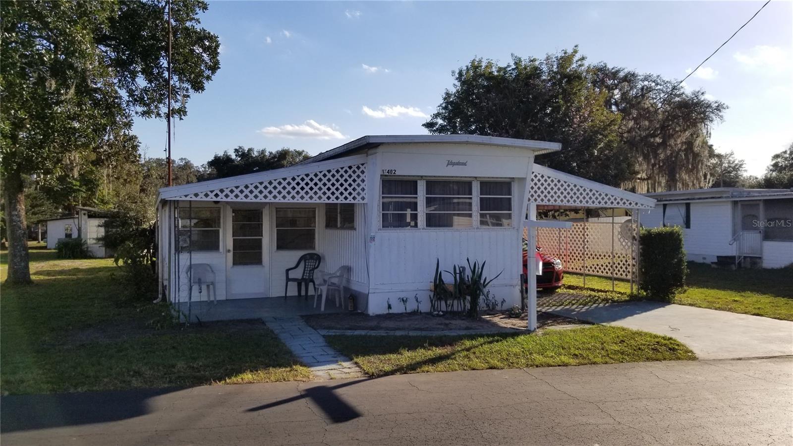 Upgraded single wide 1 Bedroom 1 Bathroom mobile home in a desirable +55 community. Home is fully furnished with a recently upgraded bathroom featuring a walk in shower. Outside laundry has a newer stacked washer and dryer. There is a new automated chair lift which lifts from the ground level Florida room up the two steps to the mobile home level. Tropical Park has many of the desirable features of park living like shuffleboard, clubhouse and its close to bus lines, shopping and restaurants. Buyers must be approved by Tropical Park HOA.