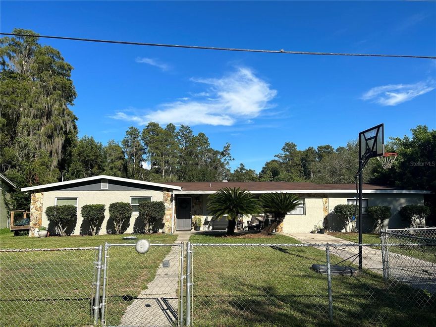 Back on market!!! Buyers financing fell through. 
A 4-bedroom, 3-full bath waterfront property in the heart of Lutz almost 100k under Market Value– need we say more? 
Situated on an oversized front yard, this home has plenty of space for little ones or pets, but the real magic lies in the backyard with gorgeous views of Cooper's Bayou. You’ll enjoy water views outlined by a mature cypress forest along with an abundance of wildlife, from turtles and herons to wood ducks, otters, and sandhill cranes. Take it all in on the covered back deck with a built-in picnic table! 

Don’t forget the fishing! Huge Large-Mouth Bass can be caught here and in the connected 79 acre Lake Cooper. The canal between these lakes has recently become overgrown, but enough elbow grease could connect them again and give you full access to even more water sports. 

Step inside, and you'll find a thoughtfully designed interior with a split floor plan. The huge master suite is a true retreat, featuring a private bathroom with a luxurious garden tub, a separate shower, and a spacious walk-in closet. It also has its own private access to the backyard deck. 

The sunken living room provides stunning water views and plenty of natural light thanks to the huge windows. Your second large bedroom also enjoys private access to the back porch, a full bathroom shared with the third bedroom, and its own spacious walk-in closet with built-in shelving.

For those looking for a dedicated workspace or a creative space, a private workshop awaits. Currently used as a knife making studio, it's insulated, air-conditioned, and is perfect for woodworking, hobbies, or even a private office.

Additional features of this home include a designated laundry room with ample built-in shelving and an additional storage closet, a galley kitchen with recently updated stainless-steel appliances, a front storage shed, and a back porch that offers plenty of room for storage. 

Sellers are motivated so bring all offers! Property would benefit from some cosmetic updates and it has been priced accordingly. It’s solid though and has already passed a recent 4-point inspection with flying colors. The HVAC system and new ductwork were completed in 2018, along with a new electrical panel. A new Rheem water heater was installed in 2020, and both the shingle roof and flat roof were completely redone just 7 years ago and have plenty of life left.

The location of this home is simply unbeatable. A quiet, friendly neighborhood with walkability to the Lutz Dog Park and Nature Trail, Lutz Branch Library, Learning Gate Charter School, John's Butcher Shop, the original Latin Spot grocery store, CheckMat Jiu Jitsu Gym, Jazzercise Dance Studio, Lutz POW Memorial Park, the Lutz Hardware and Food Depot, and much more!
With almost immediate access to 41 and Dale Mabry via Lutz Lake Fern, you'll enjoy the “20 minutes from everything Lutz Effect” and have the best of Tampa Bay right at your fingertips. Don’t forget about the Gulf Beaches and deep-sea fishing boat ramps less than an hour away! 

These Lutz properties don’t go on the market very often. The owners are a long time Lutz family that decided to move up the road, so now is your chance to own a truly rare Lutz gem and start building memories of your own! Sellers motivated so bring all offers!