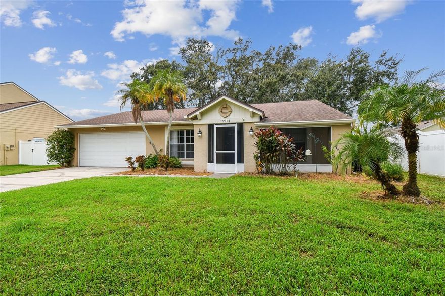 This charming 4-bedroom, 2-bath single-family home offers the perfect blend of comfort, style, and convenience nestled in a picturesque and friendly neighborhood with excellent schools. From the moment you arrive, you’ll notice the pride of ownership—this home offers both comfort and charm in every detail. Step inside to find an inviting open layout featuring ceramic tile floors throughout, making maintenance a breeze. The spacious living area centers around a cozy wood-burning fireplace, perfect for relaxing evenings or gatherings with friends and family.  The primary suite includes an ensuite bathroom, offering privacy and comfort, while three additional bedrooms provide plenty of space for family, guests, or a home office.
Enjoy peaceful mornings or sunset views from the covered, screened-in lanai overlooking a tranquil pond—your own private oasis for outdoor dining or quiet reflection. The freshly painted interior gives a bright, welcoming feel while the double garage provides convenience and extra storage space. The roof is only 7 years old giving you added peace of mind for years to come. Located near great schools, shopping, dining, and parks, this home combines beauty, practicality, and a serene setting. Come see why this lovely home is the perfect place to make lasting memories!