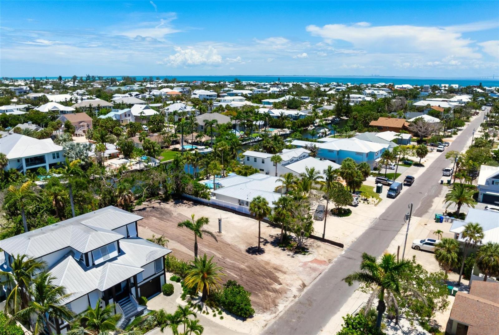 Build the ultimate island retreat on this rare, oversized 11,100 sq. ft canal front lot nestled on picturesque Oak Avenue-where Old Florida charm meets walk-to-the-beach convenience. This premier canal-front homesite nestled on the exclusive north end of Anna Maria Island. offers a rare canvas for your Luxury coastal masterpiece, or vacation rental investment. Located just one block from the Gulf of Mexico's shimmering beaches and just steps from Pine Avenue with charming local boutiques, award-winning restaurants, and a vibrant island lifestyle Anna Maria is known for. Enjoy direct boating access with no bridges, world-class sunsets, and a relaxed lifestyle defined by beauty, privacy, and prestige. Create your dream escape where island elegance meets effortless living.