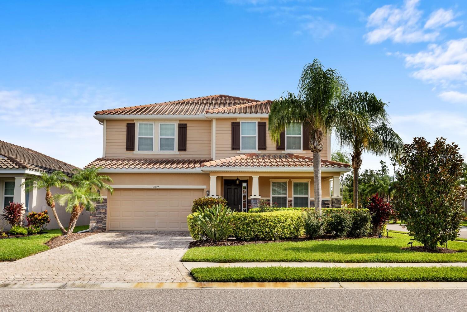 Beautifully Appointed Sarasota Home in a Prime Gated Community
Situated on a desirable corner lot within the gated community of The Soleil, this expansive two-story residence offers over 3,000 square feet of beautifully designed living space, featuring 4 bedrooms, 3 full bathrooms, and a versatile bonus loft. The charming stone elevation and brick paver front porch set the tone for the elegant interiors that follow. A grand foyer opens to a formal dining room enhanced by soaring ceilings, tile flooring, and generous picture windows that fill the space with natural light.
The heart of the home is the spacious family room, perfectly connected to a chef’s kitchen complete with granite countertops, stainless steel appliances, subway tile backsplash, solid wood cabinetry, a butler’s prep area, and a massive walk-in pantry. A guest bedroom and full bath with granite vanity and large tiled walk-in shower are conveniently located on the main floor.
Upstairs, a generous loft provides flexible living space for a game room or second family room. The luxurious primary suite features a double-door entry, private sitting area, tray ceilings, spa-like ensuite with dual vanities, soaking tub, walk-in shower, and a spacious walk-in closet with direct access to the laundry room. Two additional bedrooms and a full bath with dual sinks and tub/shower combo complete the upper level.
Outside, enjoy the privacy of a fully fenced backyard with ample space to add a pool. Residents of The Soleil enjoy premium amenities including a community pool, dog park, fitness center, bocce court, and more. Ideally located just off University Boulevard with easy access to Highway 301, Sarasota Airport, and top-tier shopping and dining.